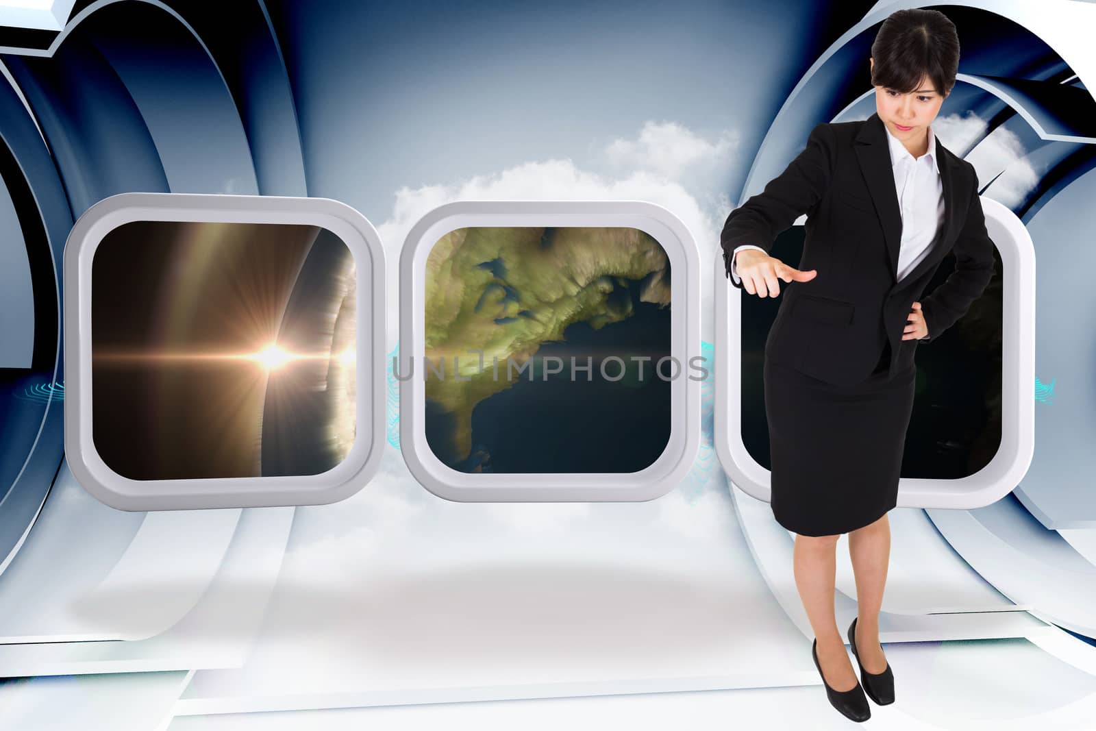 Composite image of businesswoman pointing by Wavebreakmedia