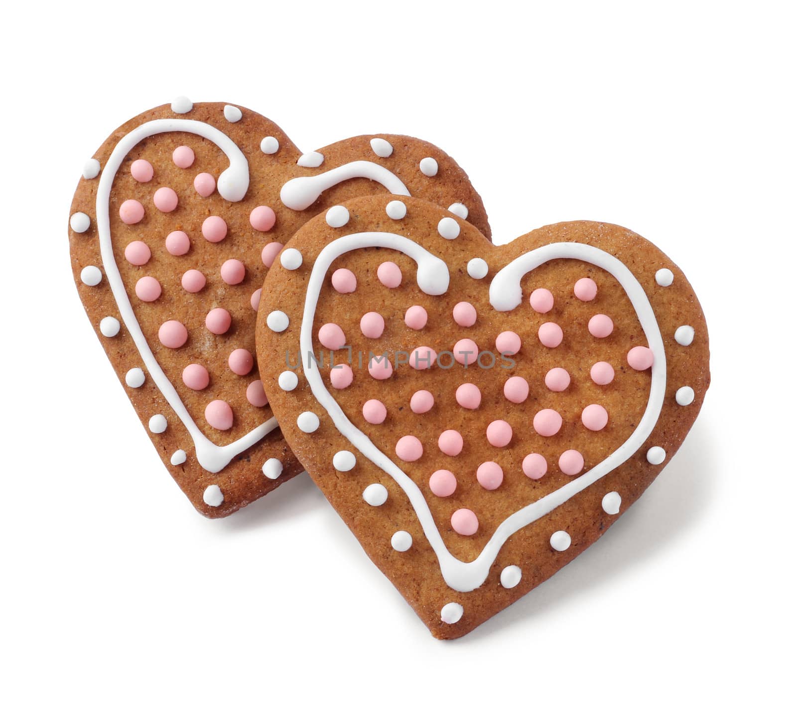 Two heart shaped gingerbreads isolated by anterovium