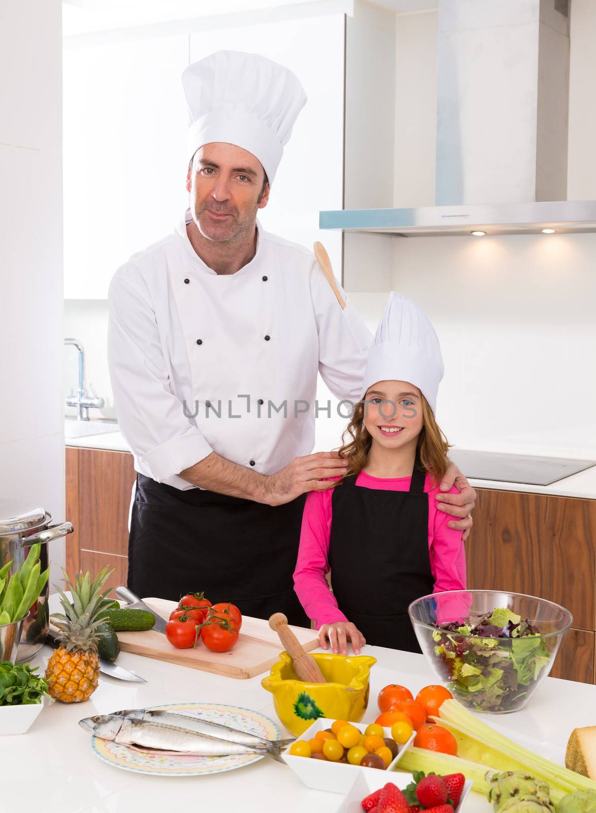 Chef master and junior pupil kid girl at cooking school by lunamarina