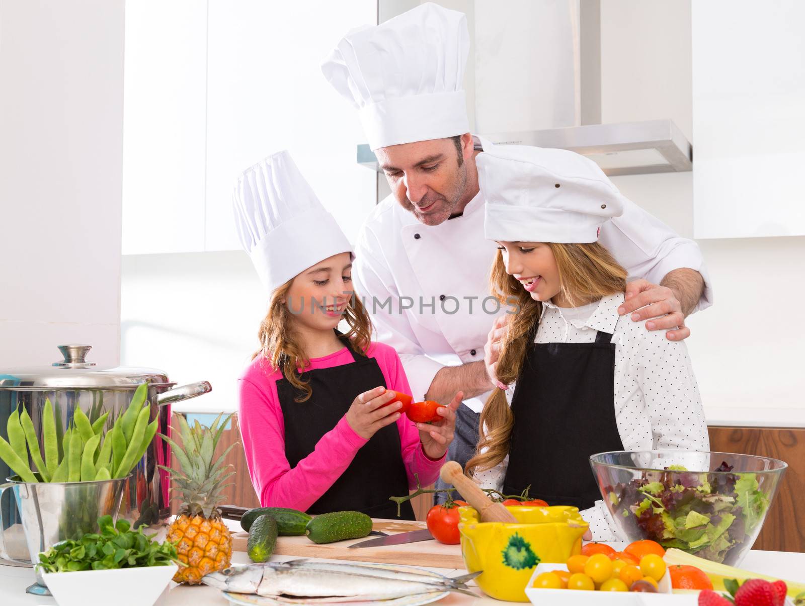 Chef master and junior pupil kid girls at cooking school by lunamarina