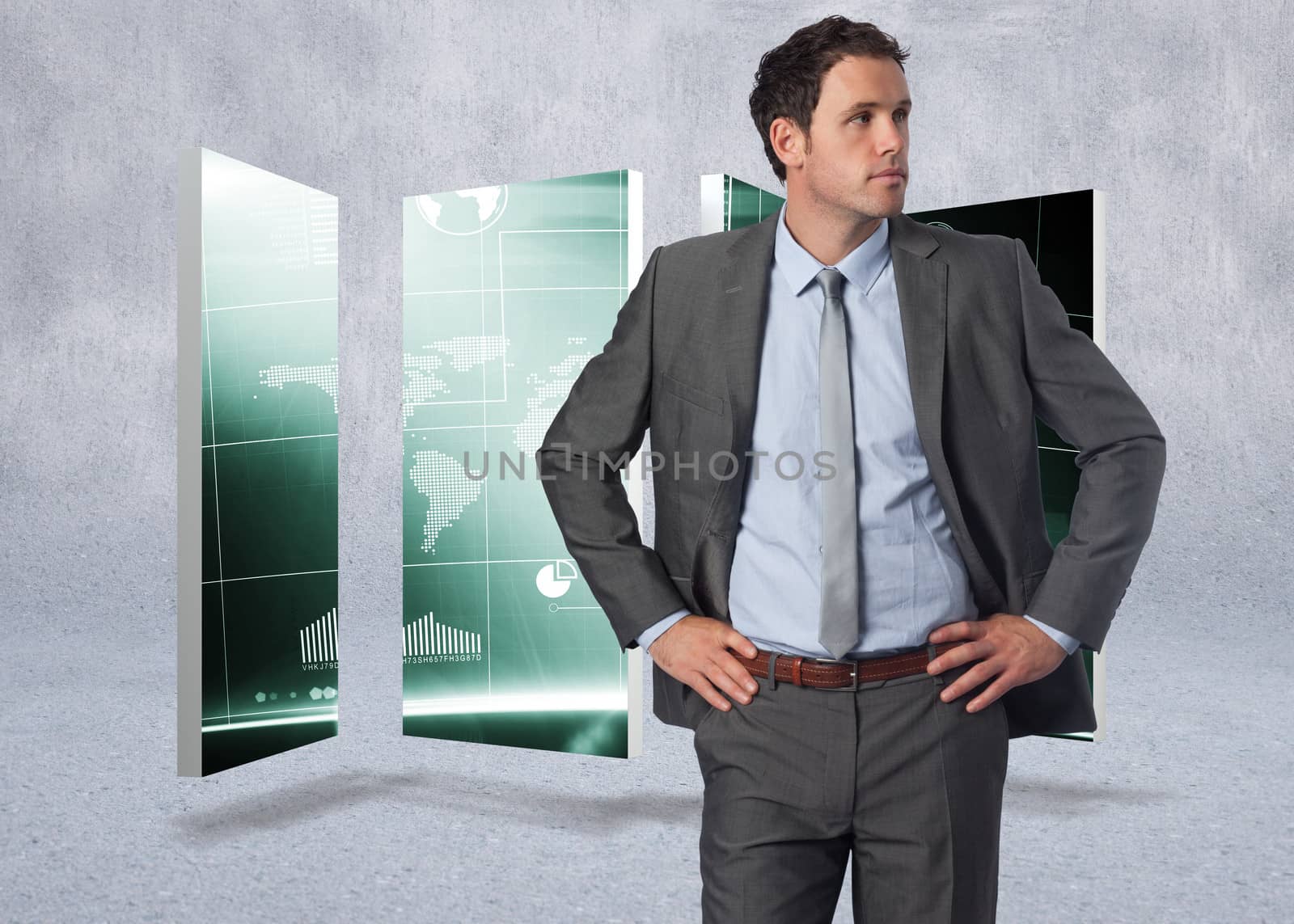 Composite image of serious businessman with hands on hips by Wavebreakmedia