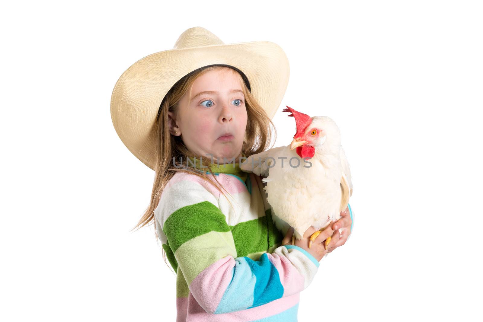 Funny kid girl expression surprised gesture scared of hen by lunamarina