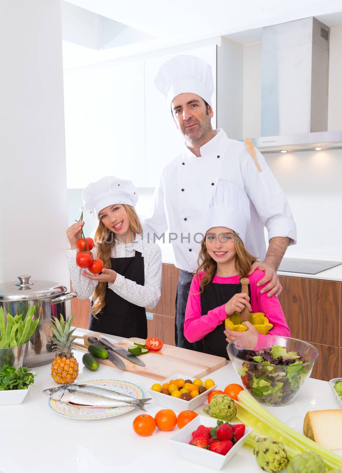 Chef master and junior pupil kid girls at cooking school by lunamarina