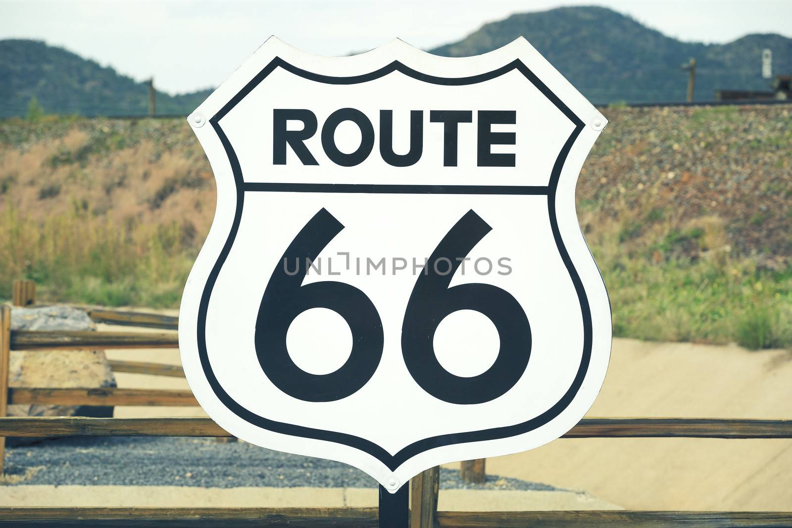 A scenic view of a historic Route 66 sign