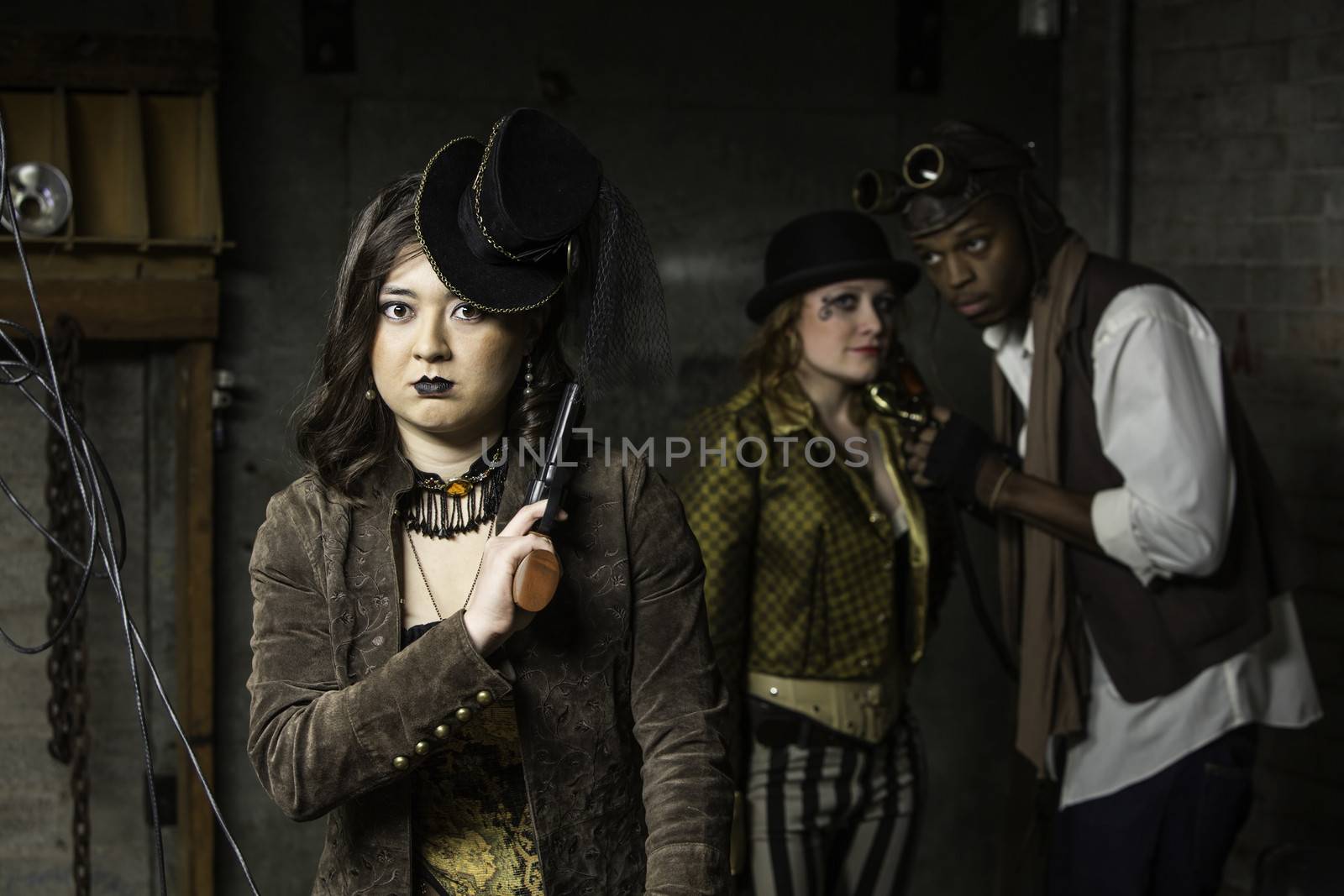 Young Steam Punks PosIng in Underground Lair