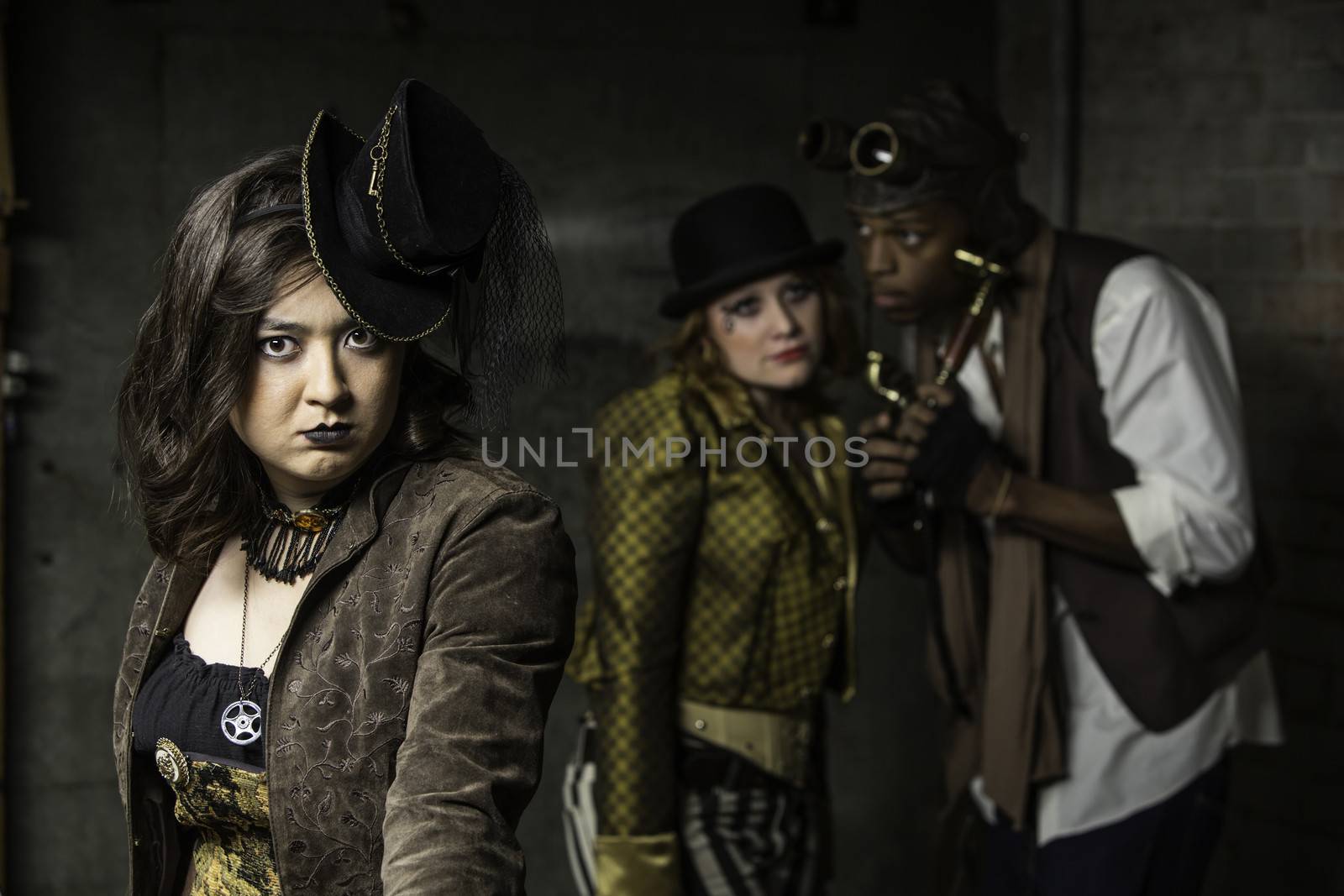 Young Steam Punks PosIng in Underground Lair 