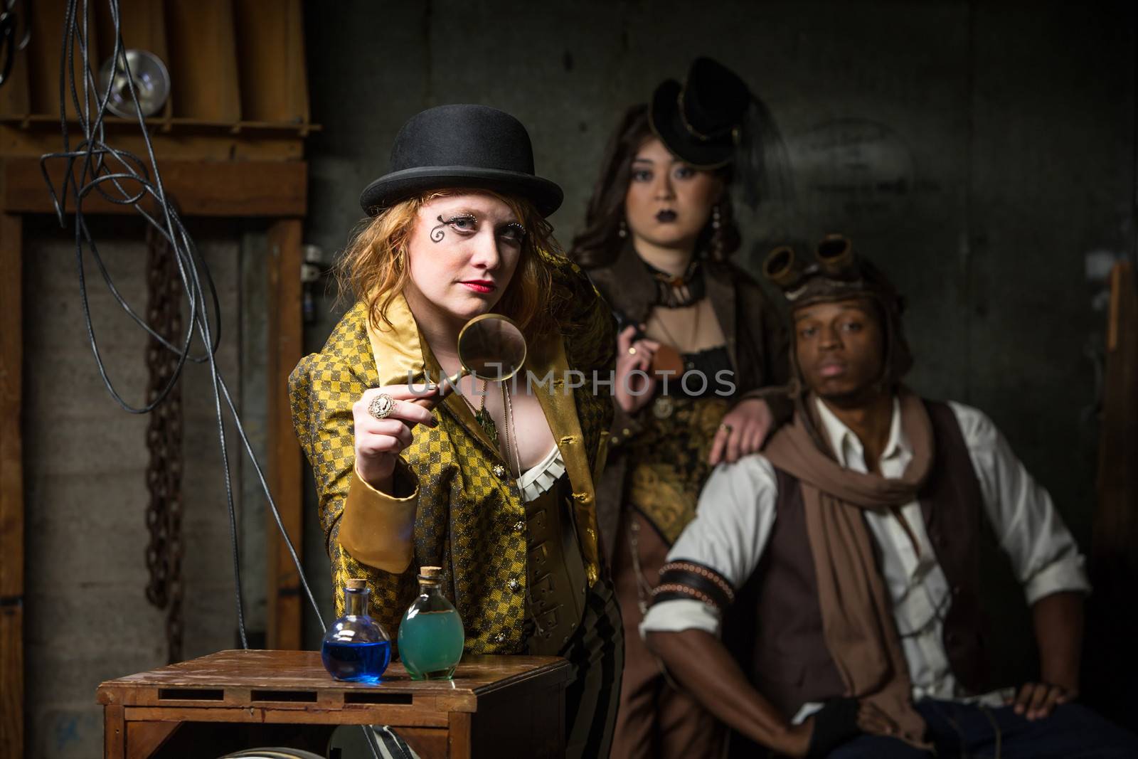 Three Steampunks with in Retro Lab with Potions