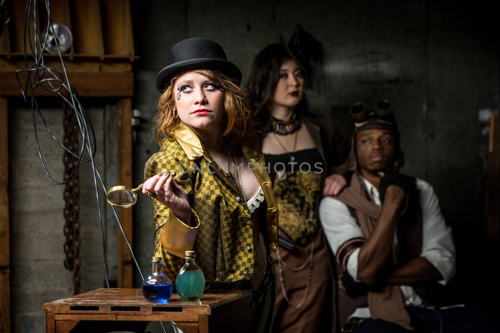 Three Steampunks with in Retro Lab with Potions