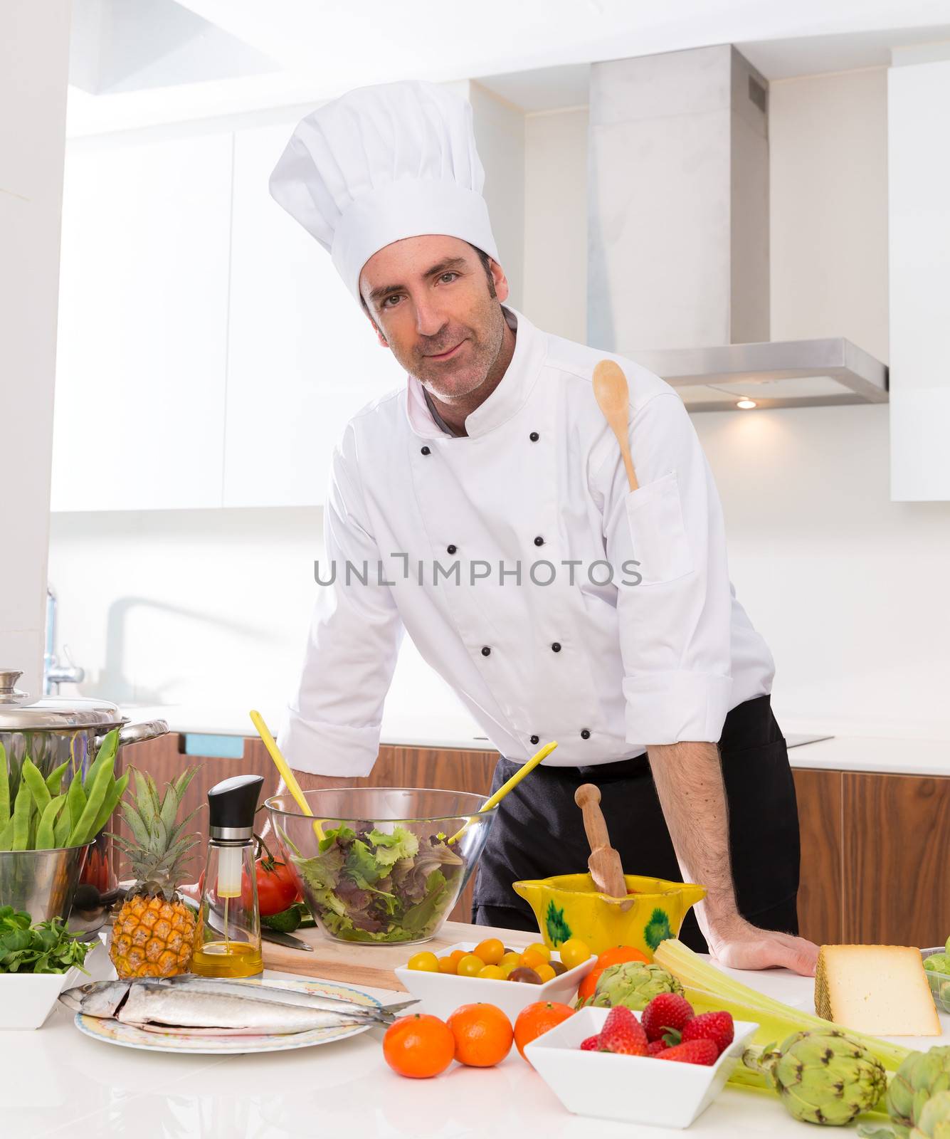 Chef male portrait on white countertop at kitchen by lunamarina