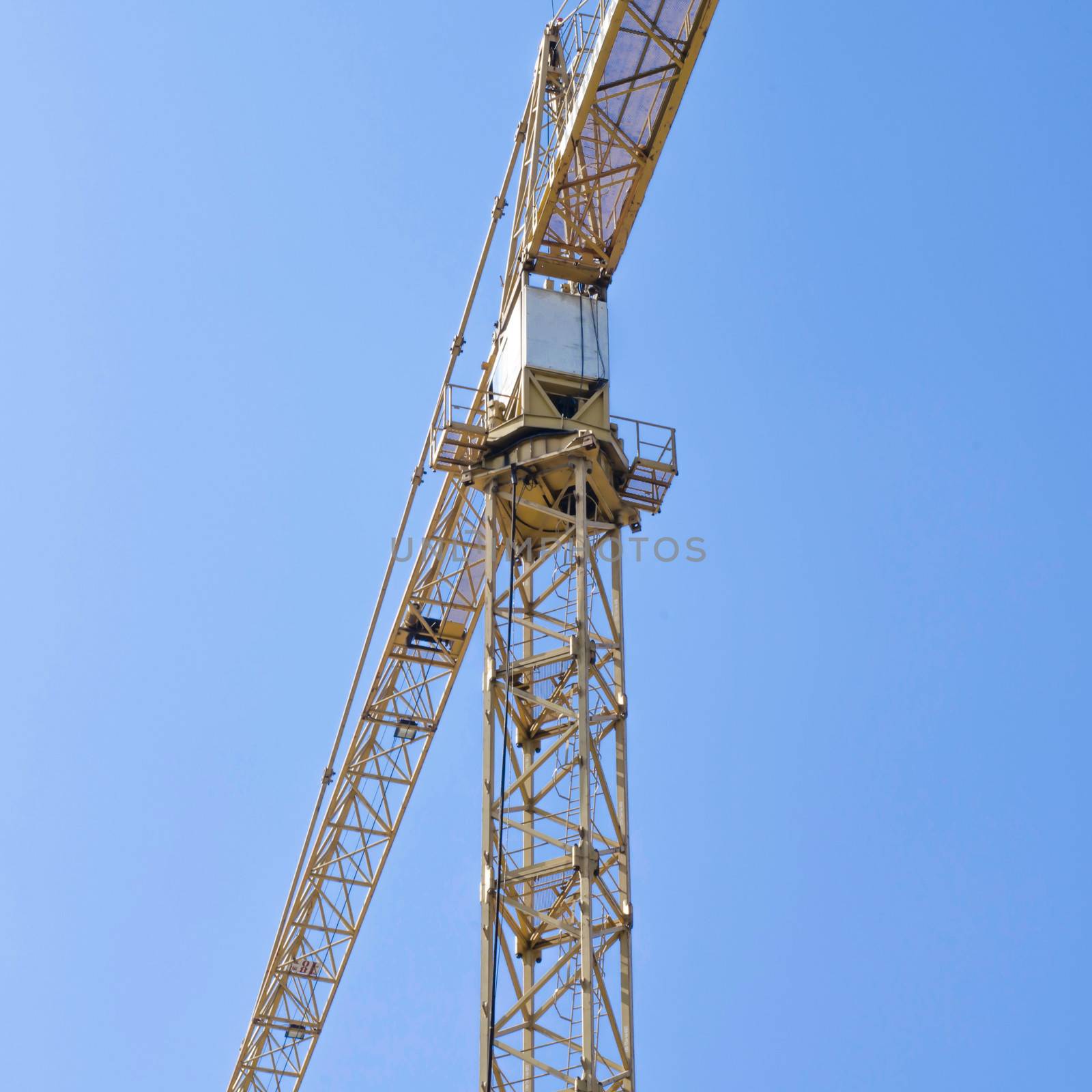 crane on blue sky background by ammza12