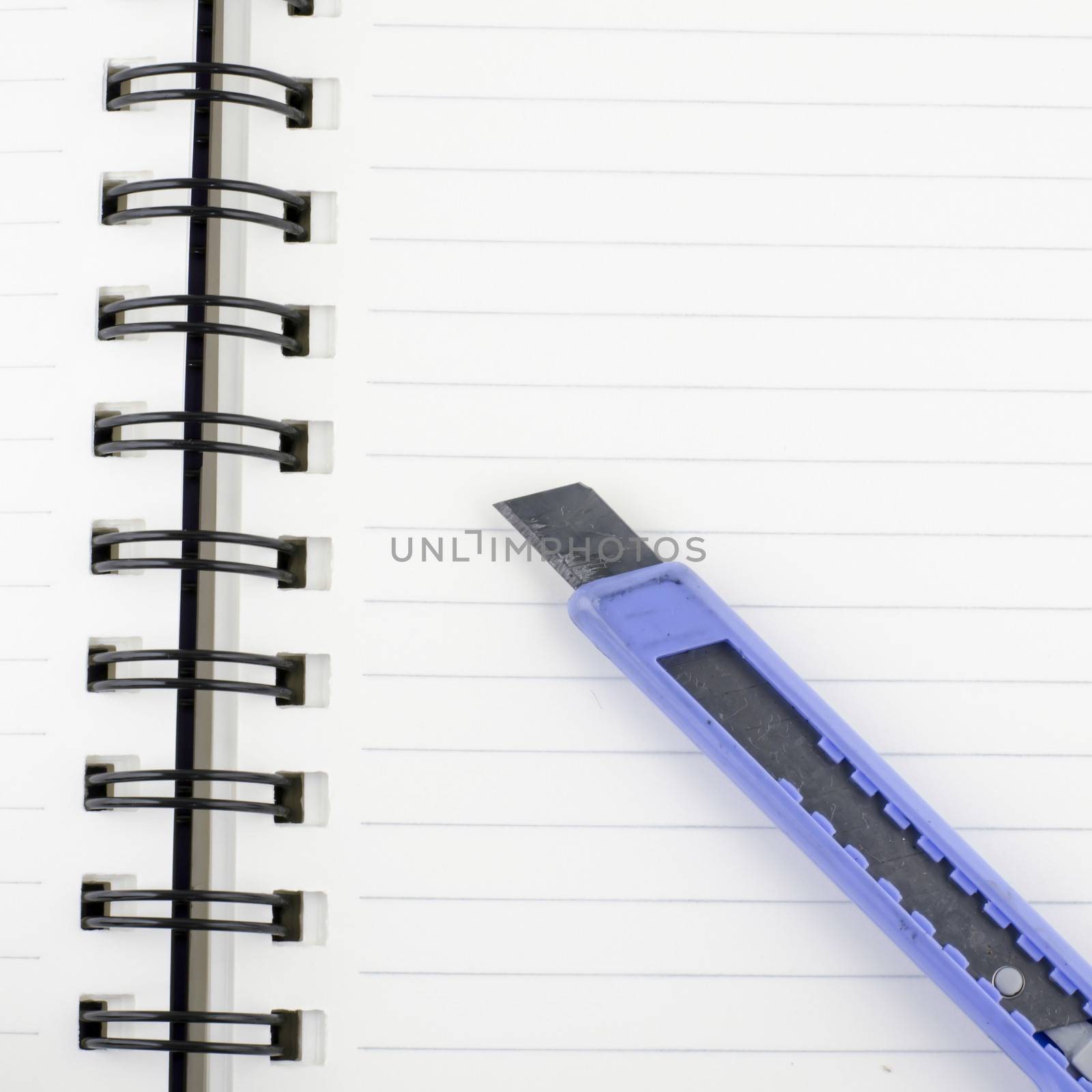 cutter on notebook background texture