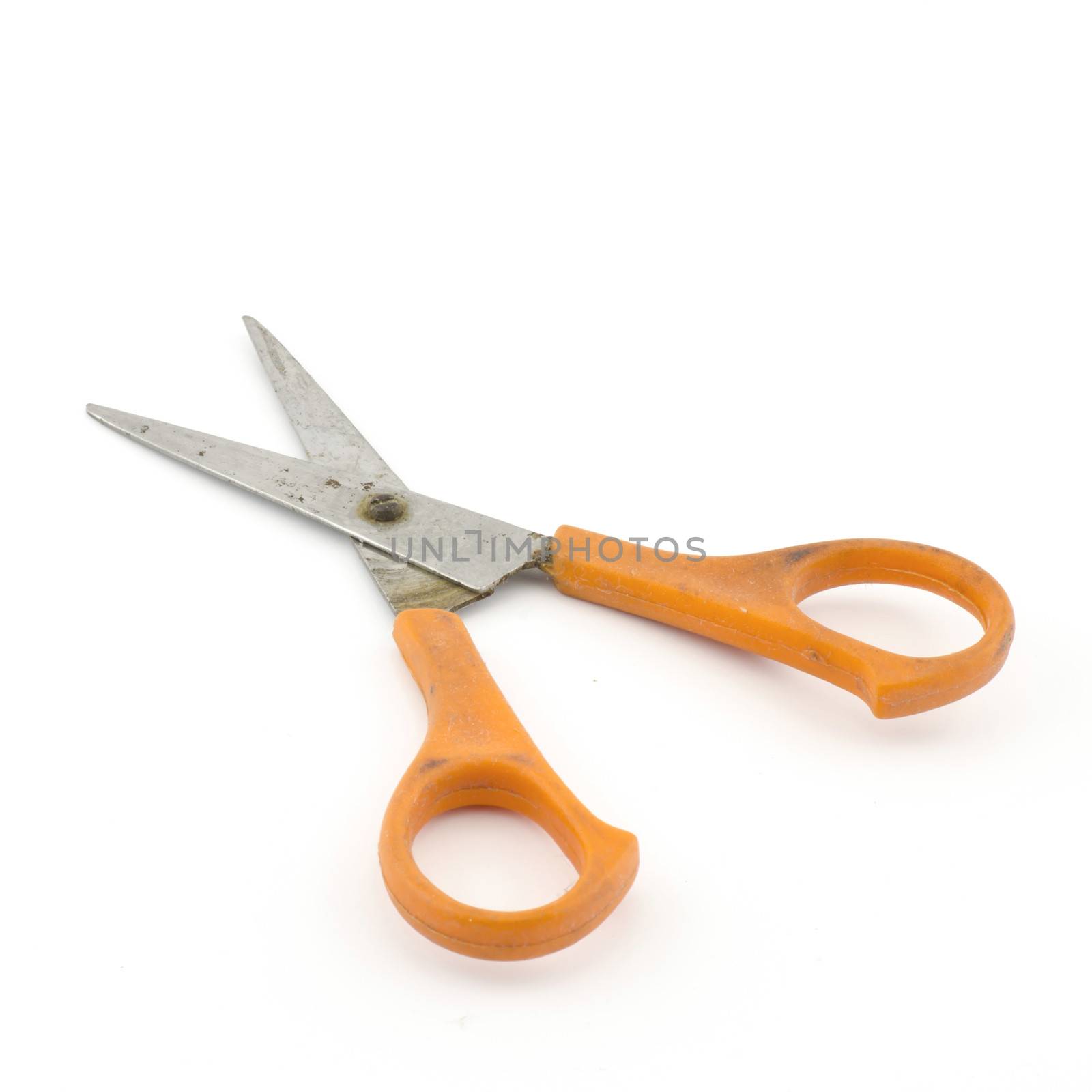 orange used scissors isolated on white  by ammza12