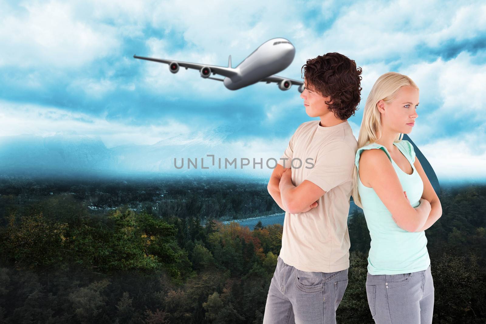 Composite image of unhappy couple posing by Wavebreakmedia