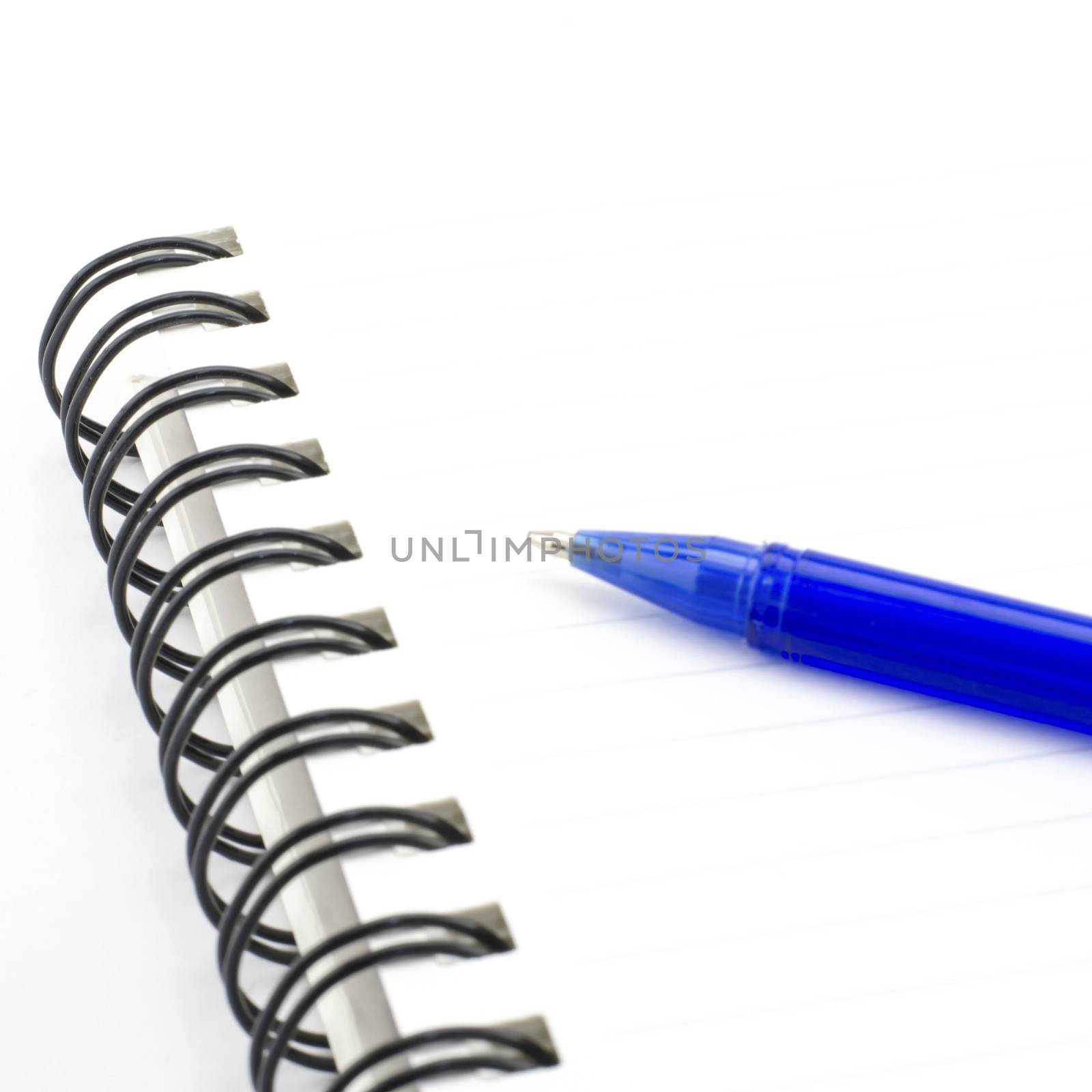 blue pen with notebook isolated on white background