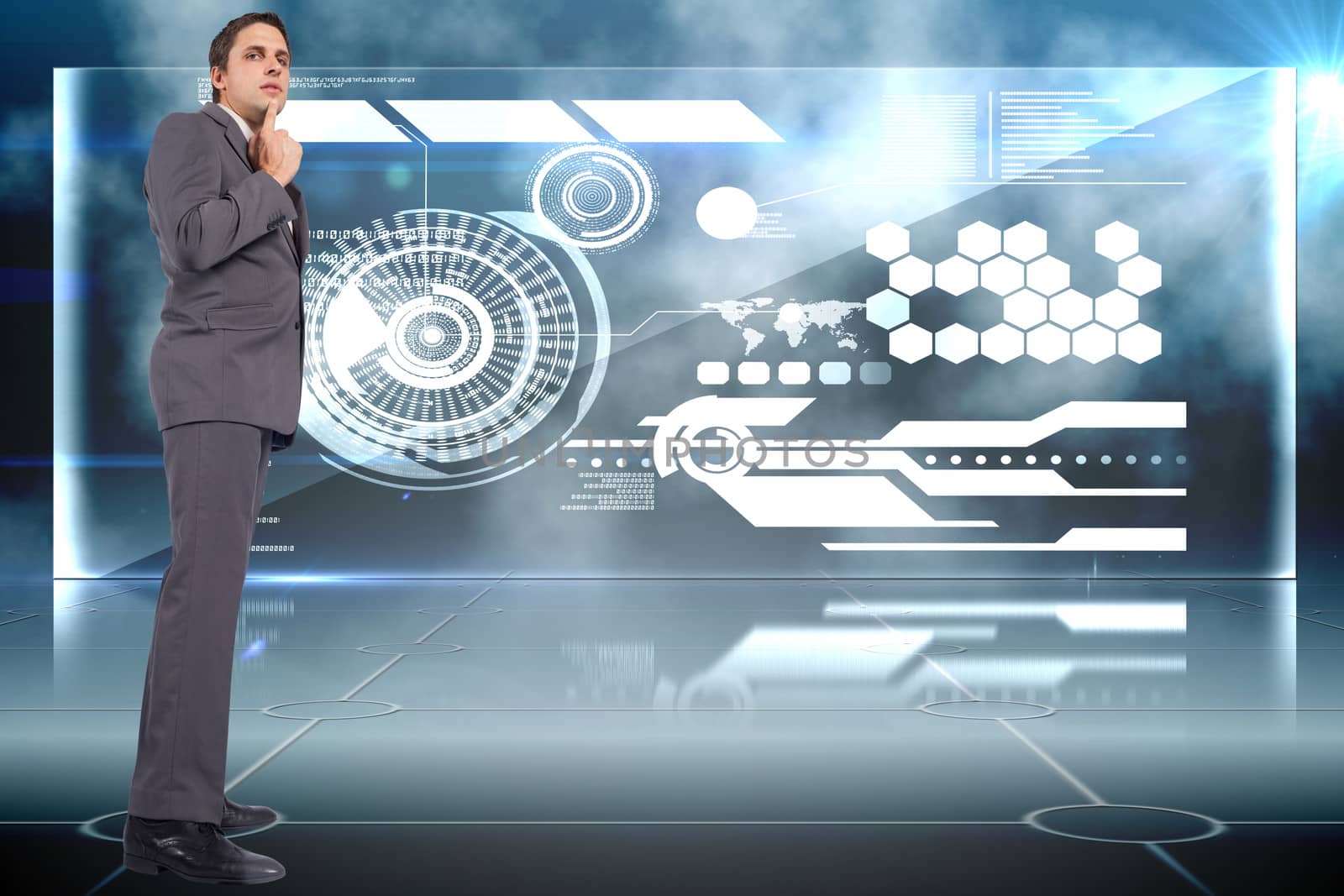 Thinking businessman with hand on chin against futuristic technology interface