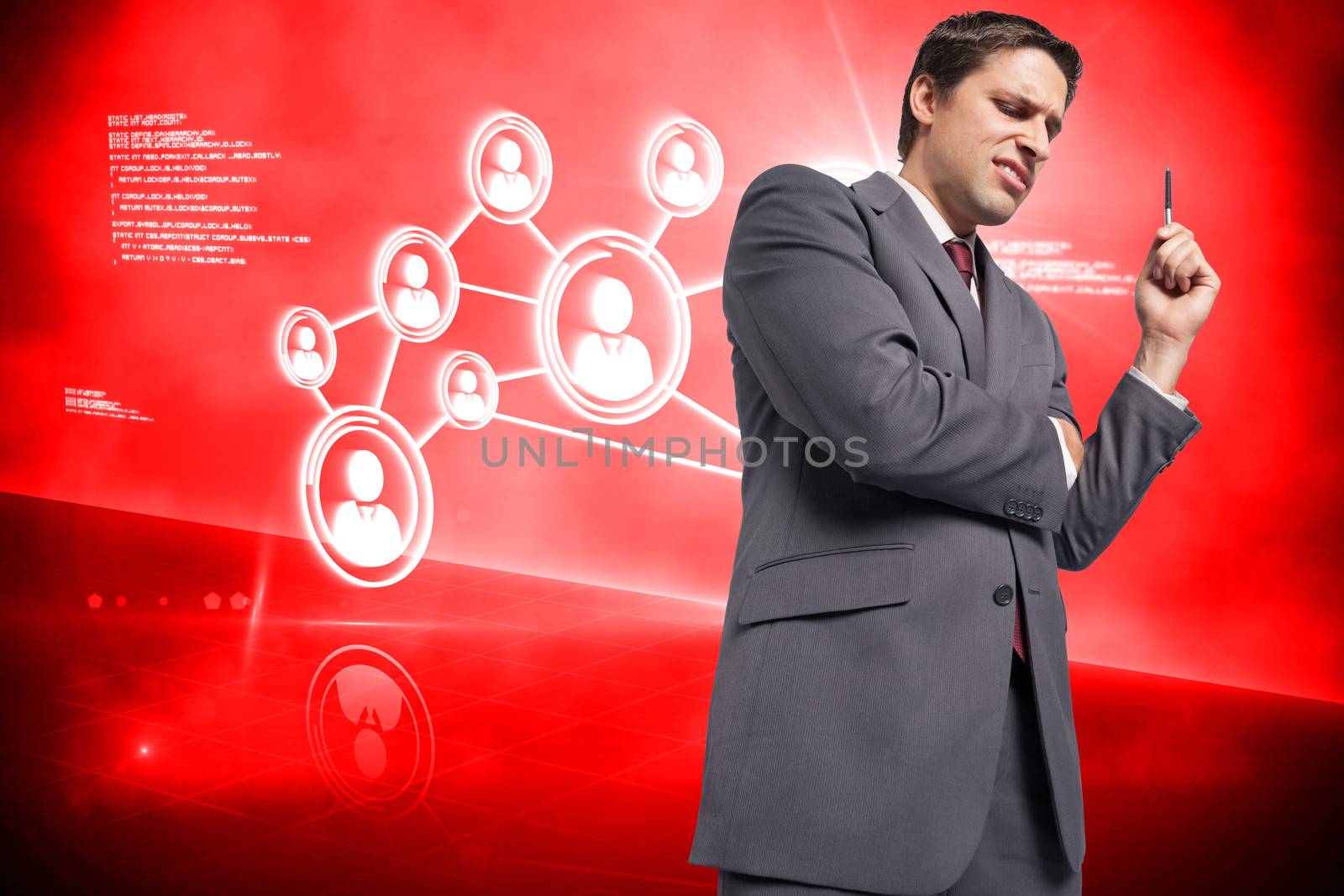 Composite image of thoughtful businessman holding pen by Wavebreakmedia