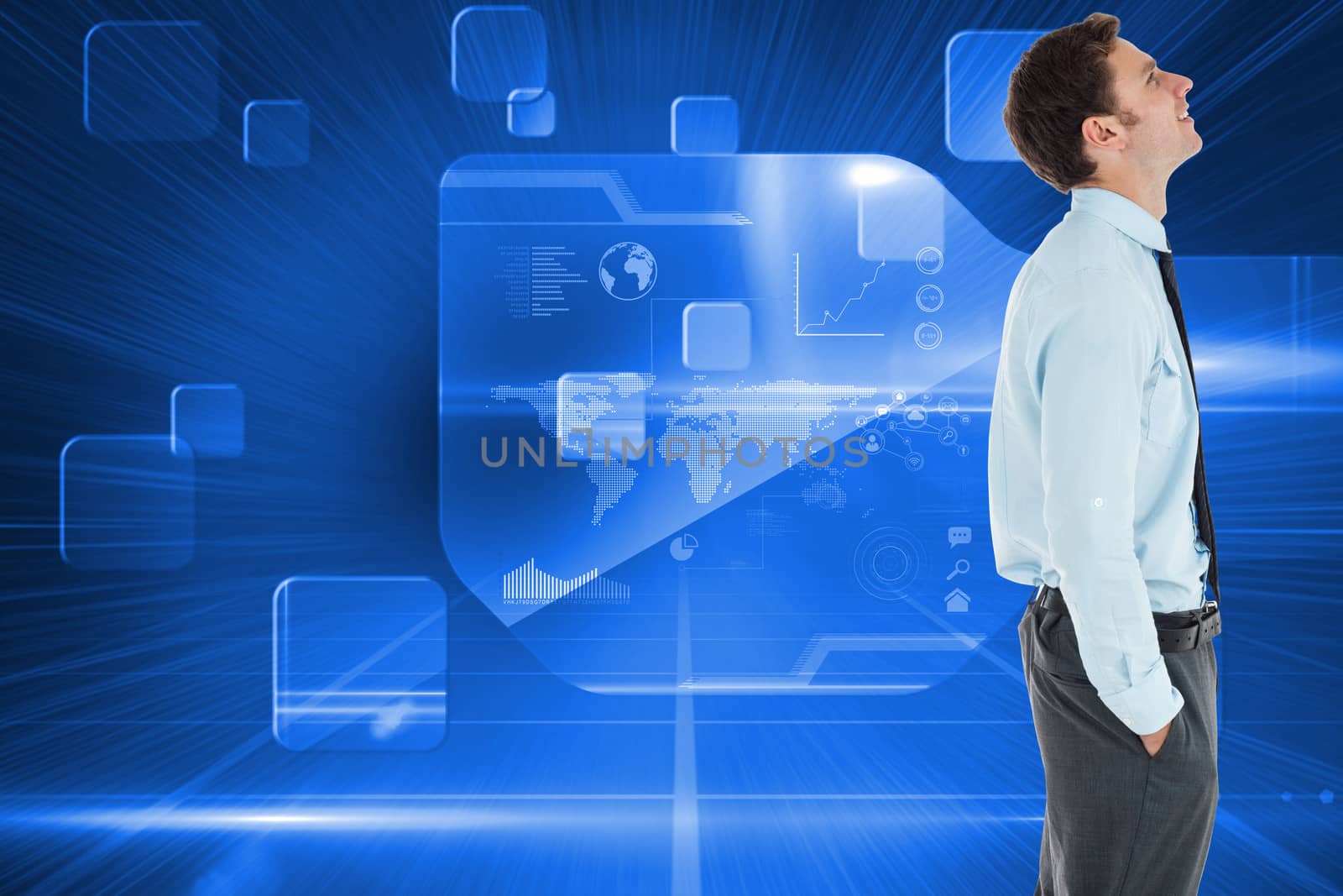 Happy businessman standing with hand in pocket against futuristic technology interface