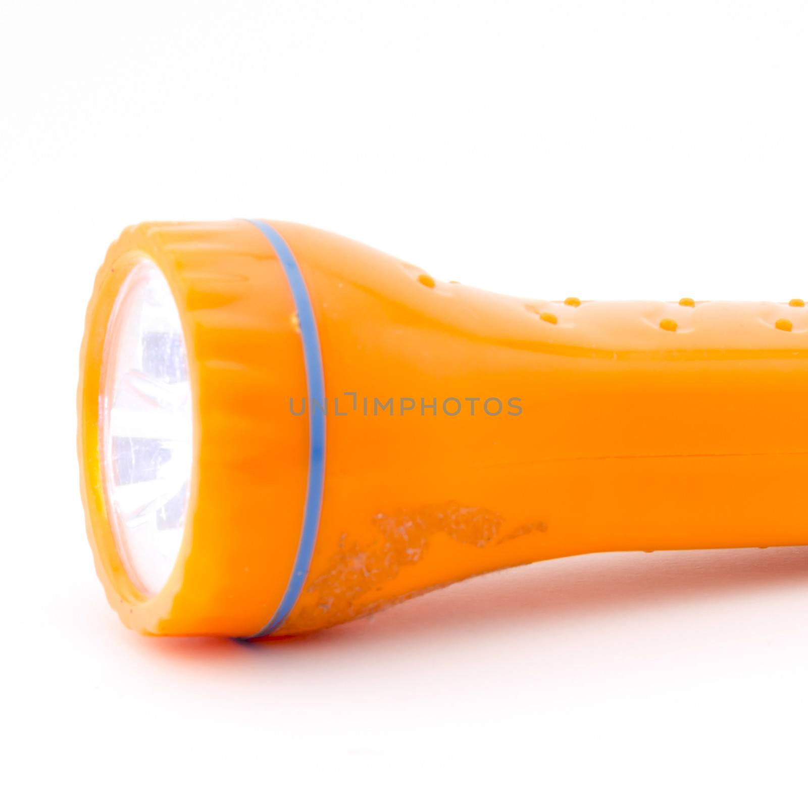 orange flashlight isolated on white background