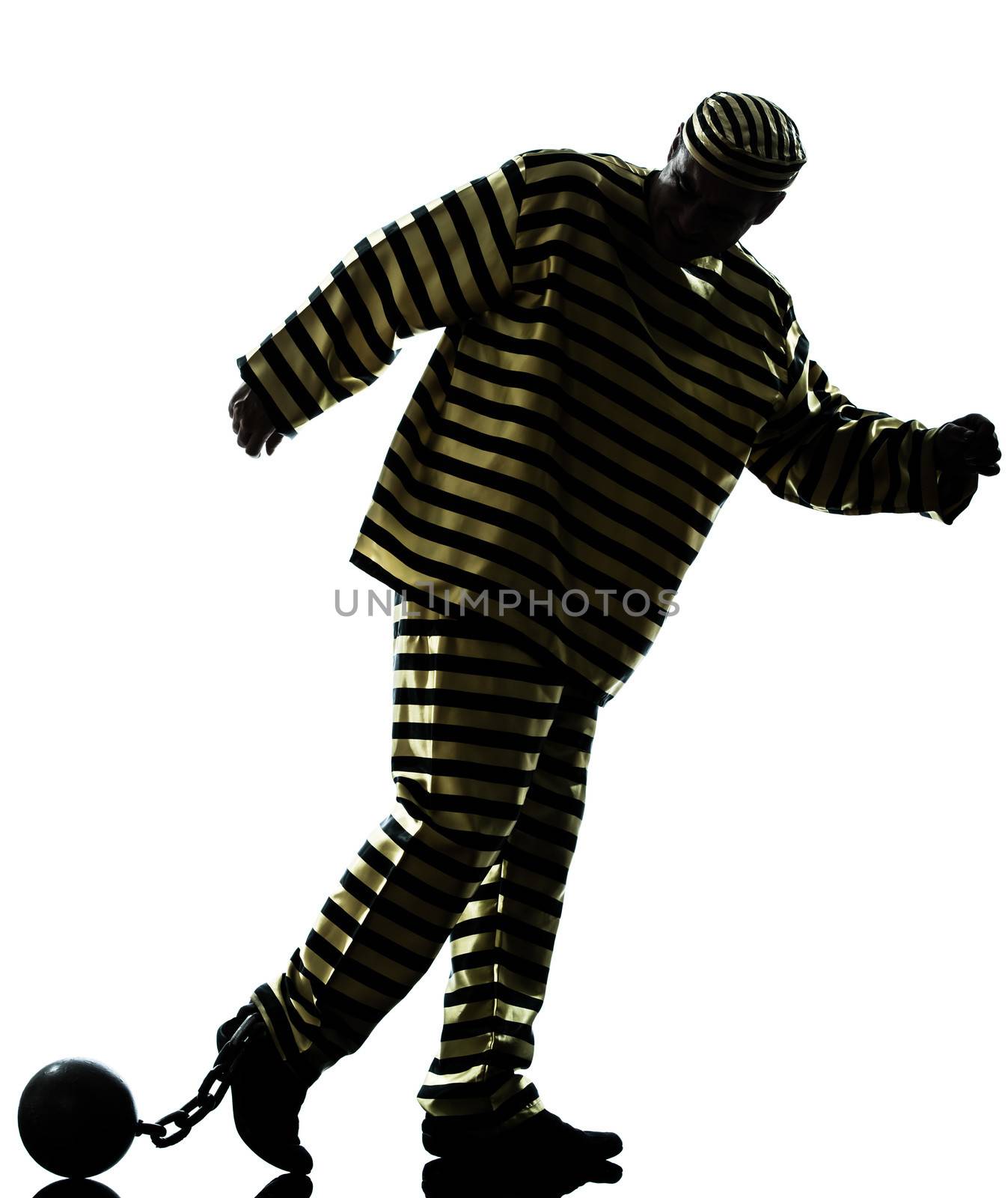 one caucasian man prisoner criminal with chain ball silhouette in studio isolated on white background