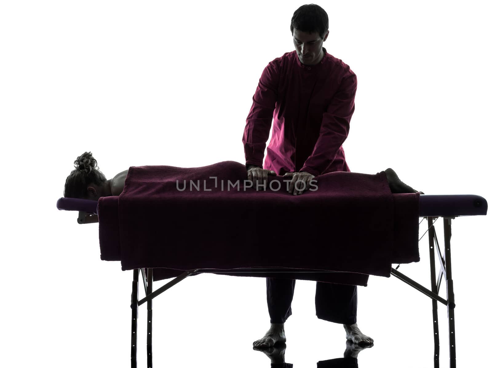 man woman back massage in silhouette studio on white background