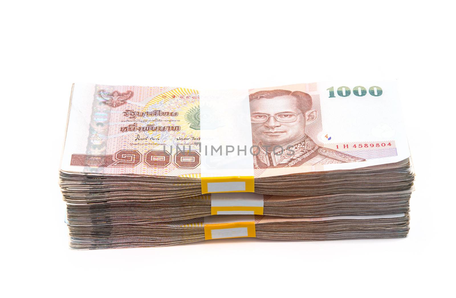 Stacks of 1000 baht bills by Sorapop
