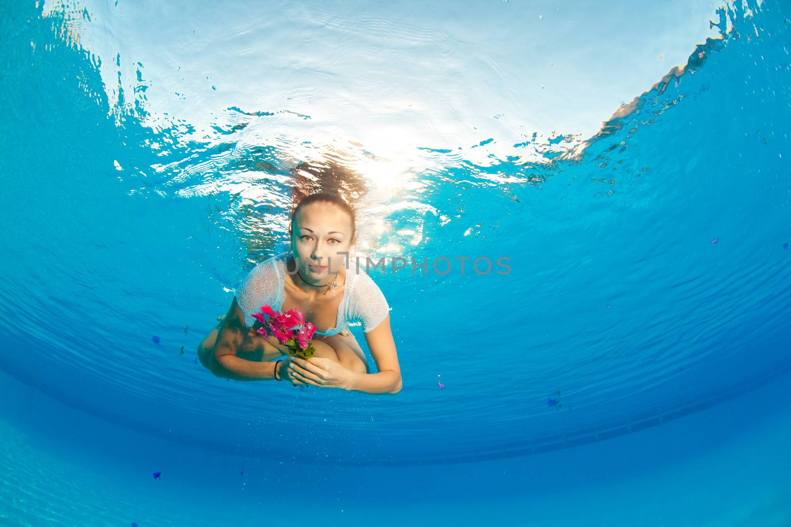 underwater portrait with flower