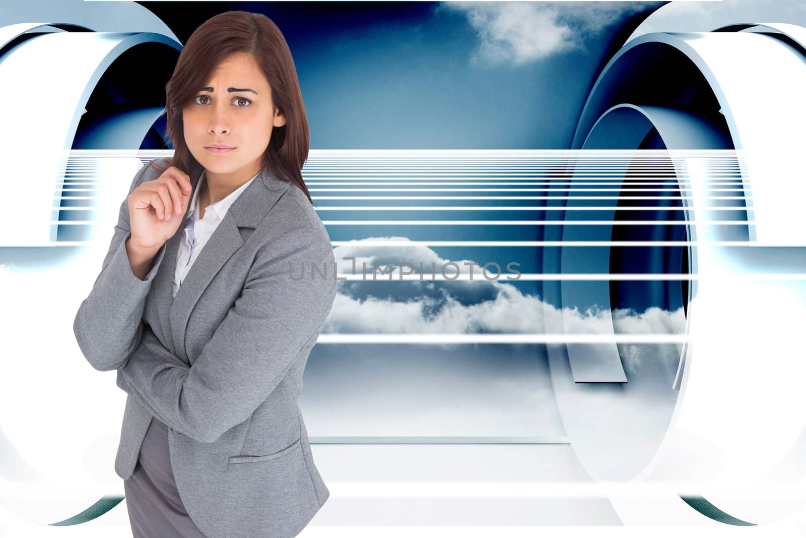 Worried businesswoman against abstract cloud design in futuristic structure