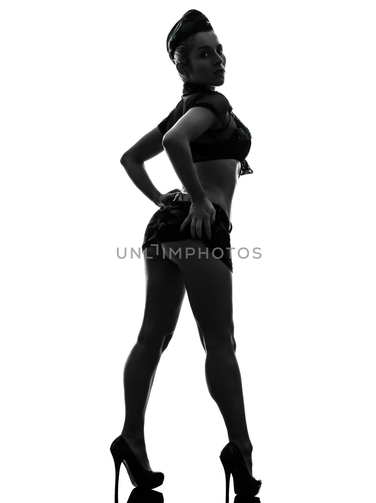 rear view one caucasian sexy woman in army uniform in silhouette studio isolated on white background