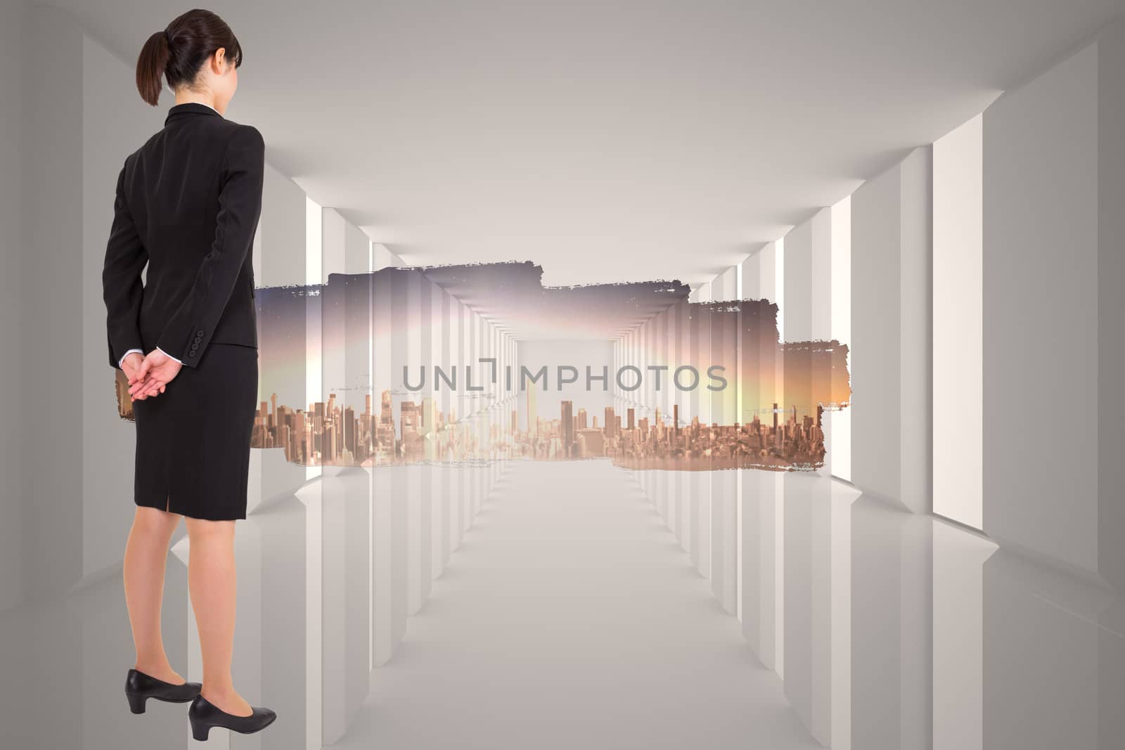 Composite image of businesswoman standing by Wavebreakmedia