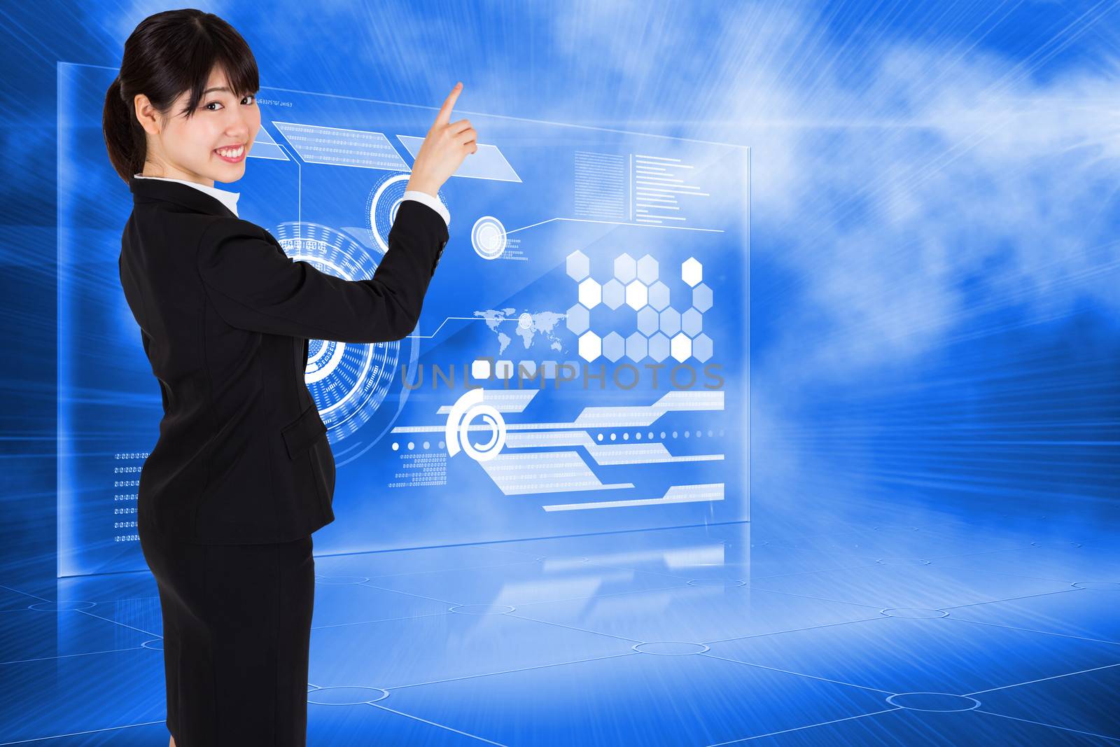 Smiling businesswoman pointing against futuristic technology interface