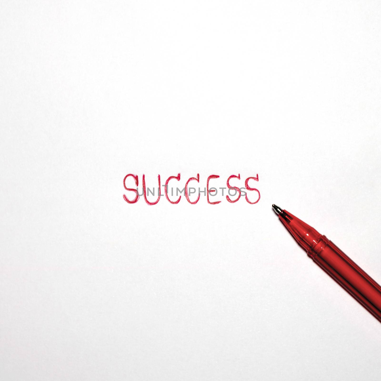 red success word with red pen isolated on white background