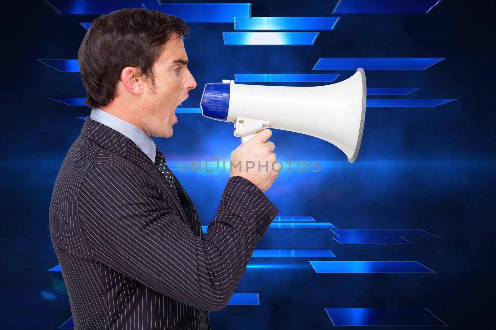 Profile of a businessman shouting through a megaphone against abstract technology background