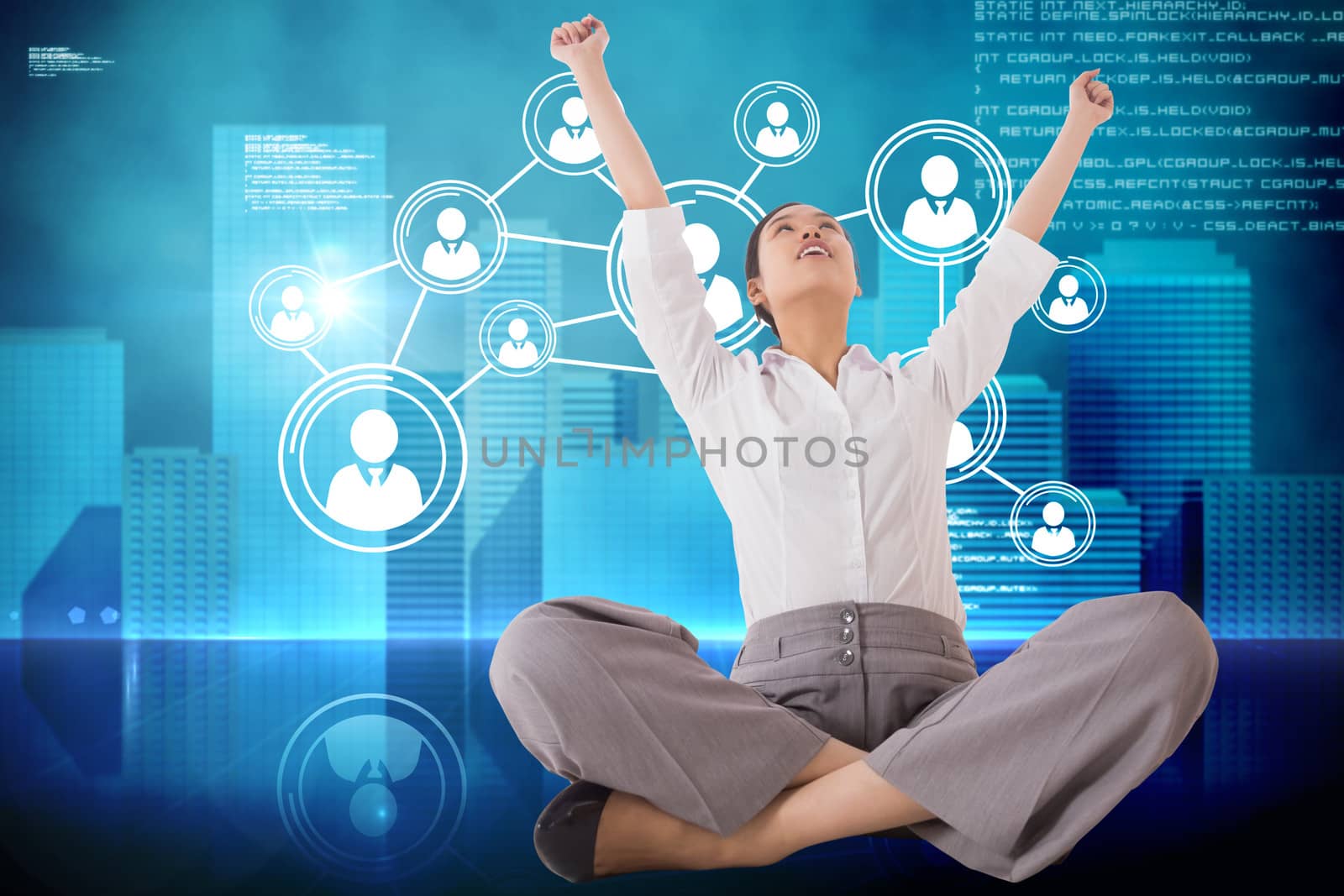 Cheering businesswoman sitting cross legged against futuristic technology interface