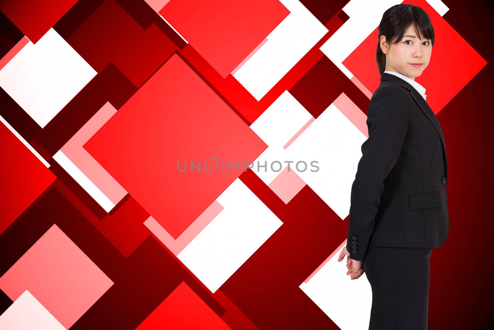 Serious businesswoman against abstract technology background