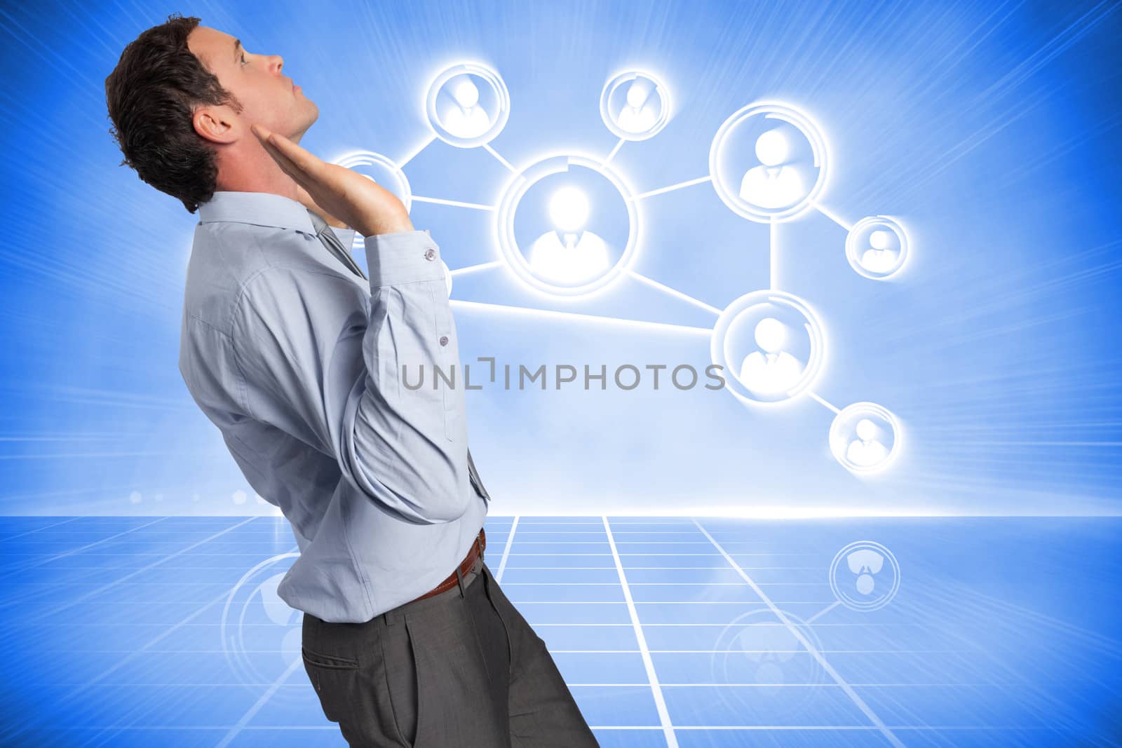 Composite image of businessman standing with arms pushing up by Wavebreakmedia