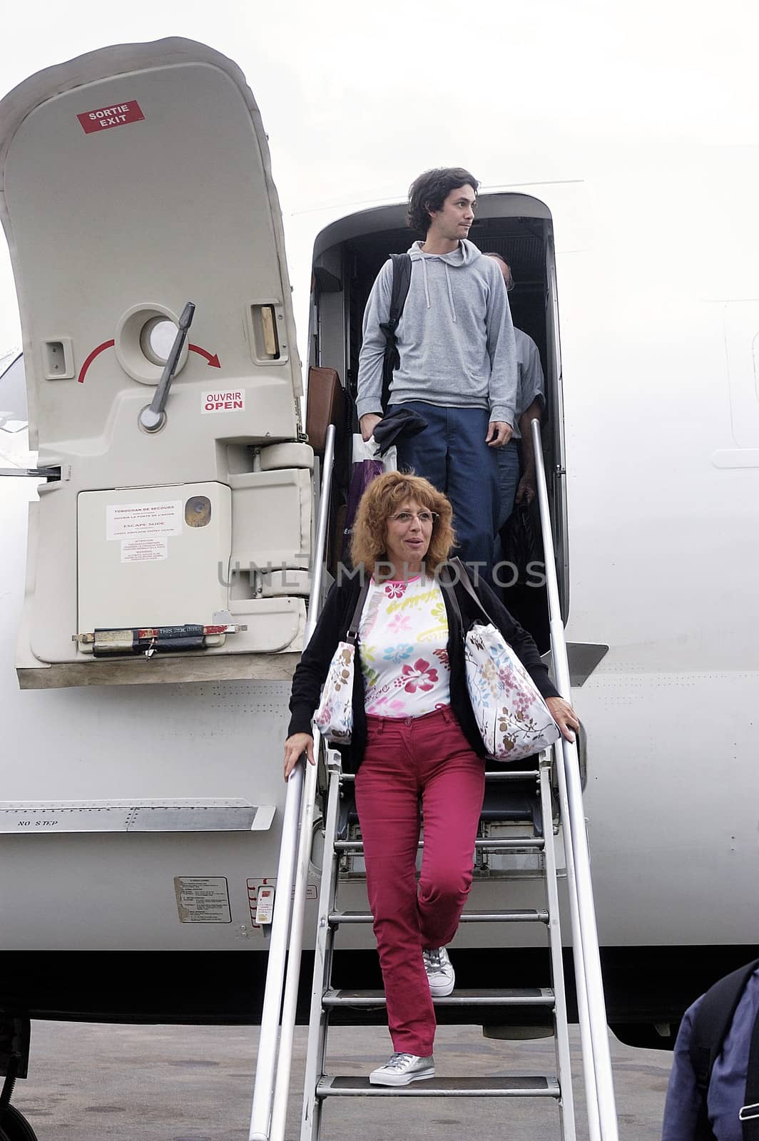 Disembarking passengers of an airliner company Air Burkina in Ouagadougou airport