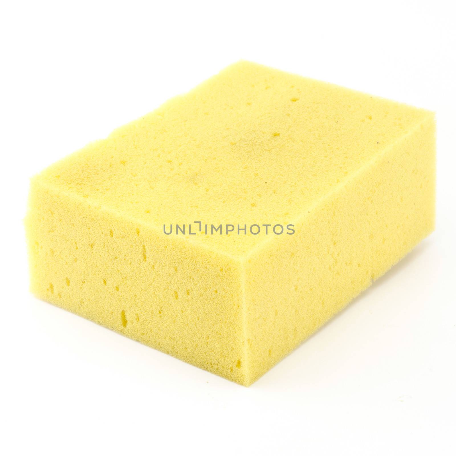 yellow household sponge isolated on white background