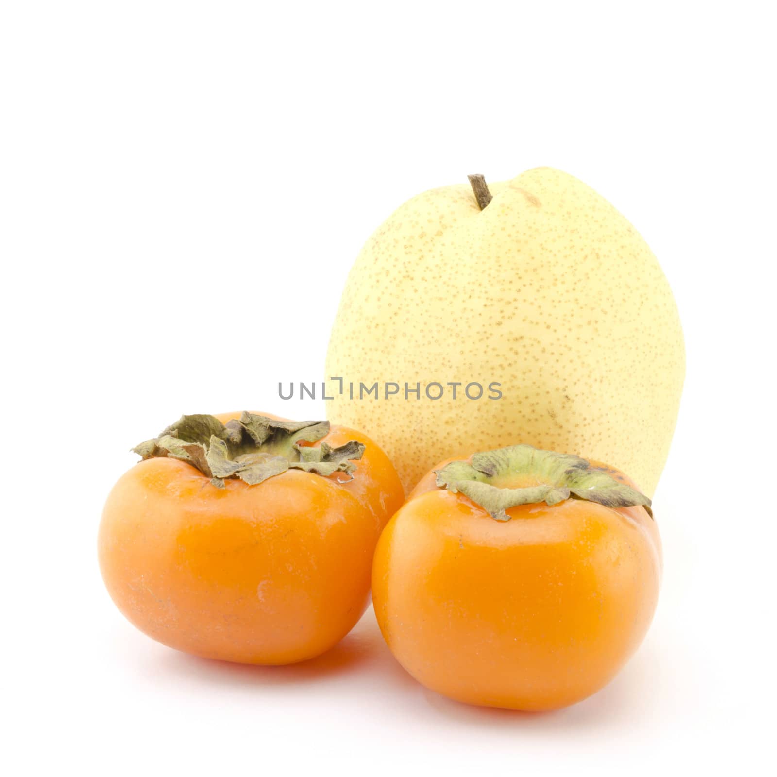 chinese pear and two persimon isolated on white background