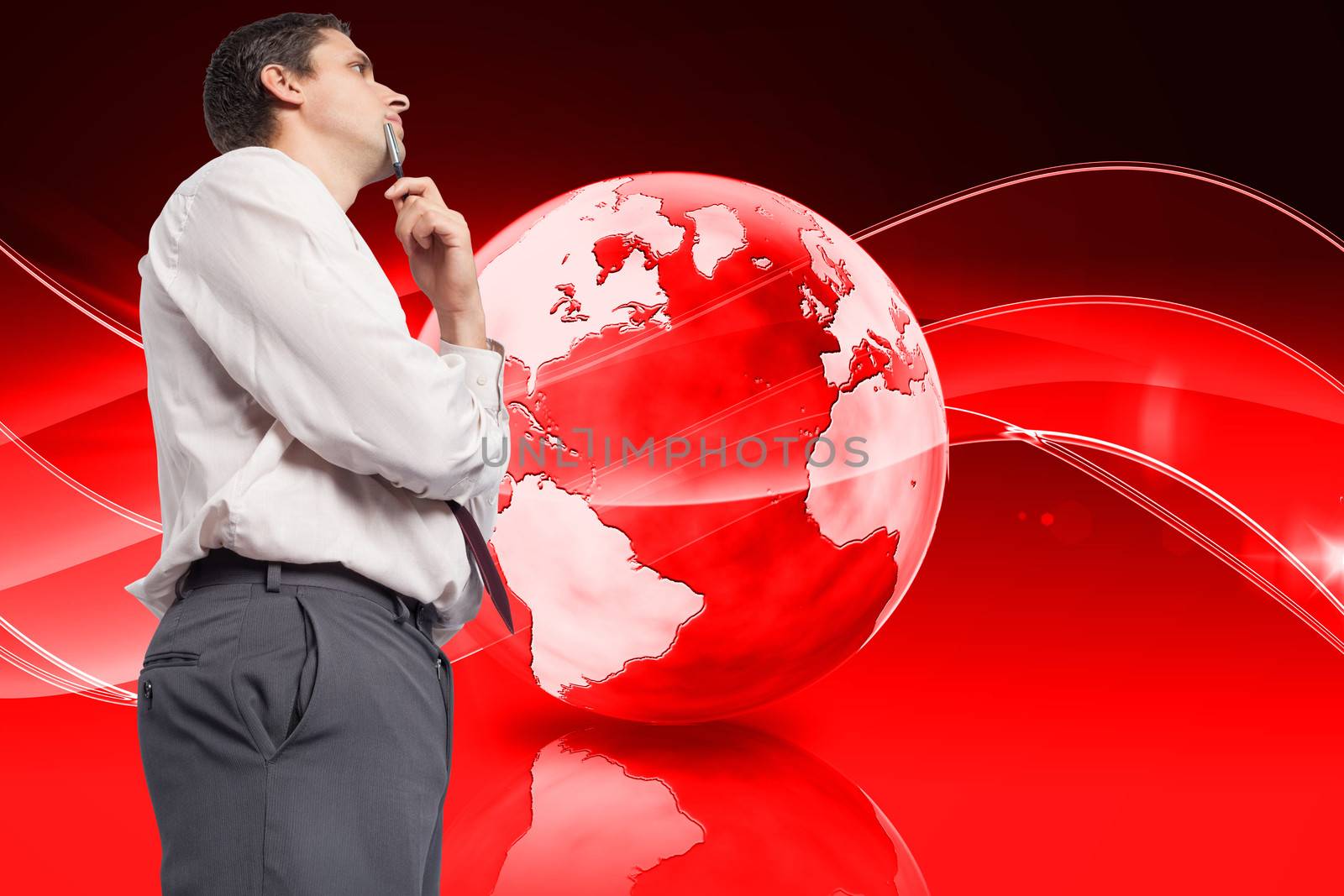 Thoughtful businessman holding pen to chin against global technology background