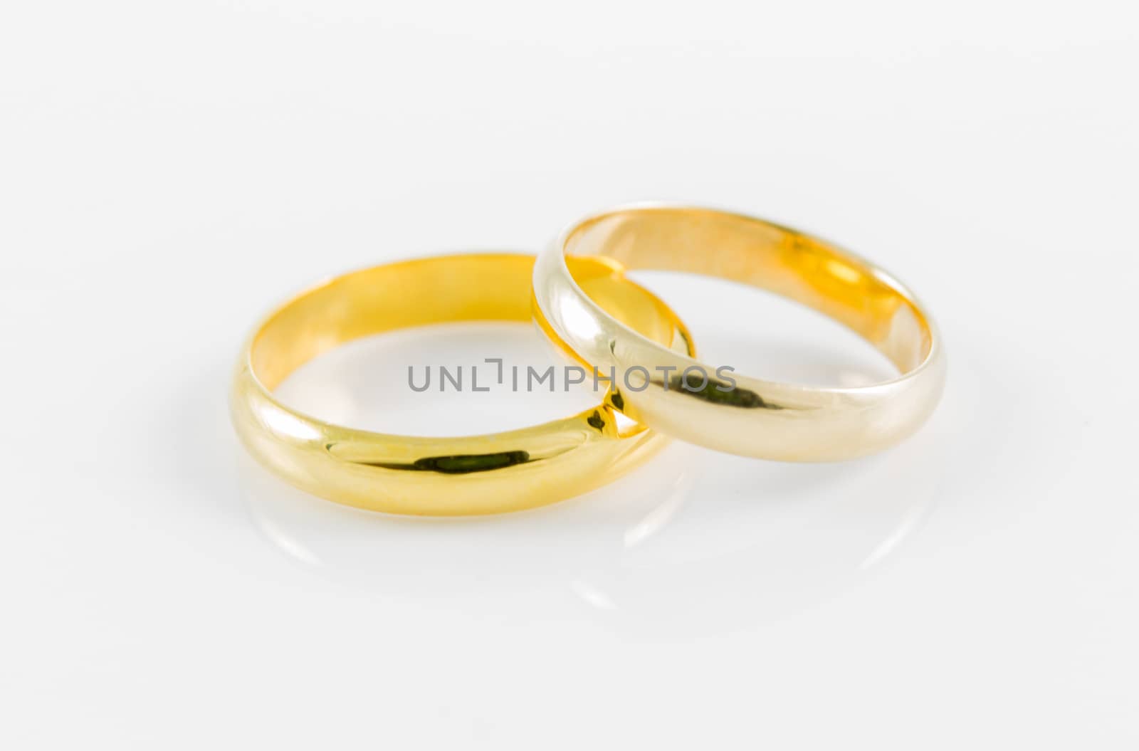 pair wedding golden ring on a white background