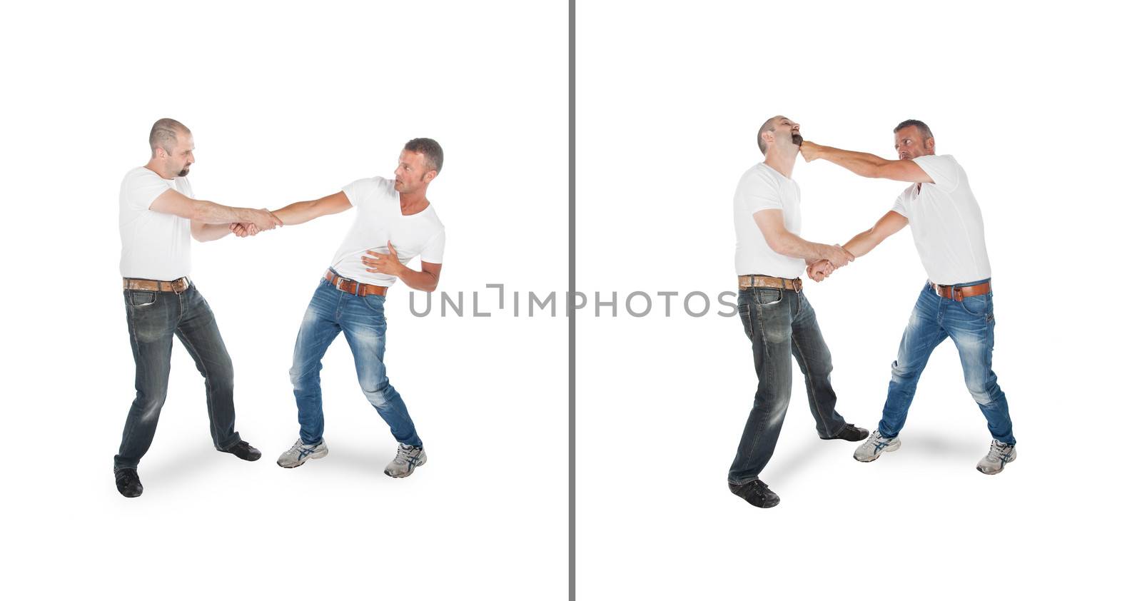 Man defending against wristgrab, isolated on white