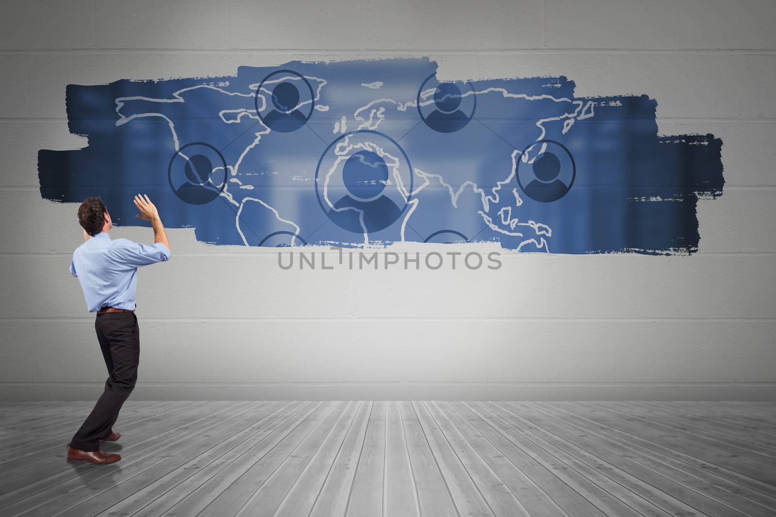 Composite image of businessman posing with arms up by Wavebreakmedia