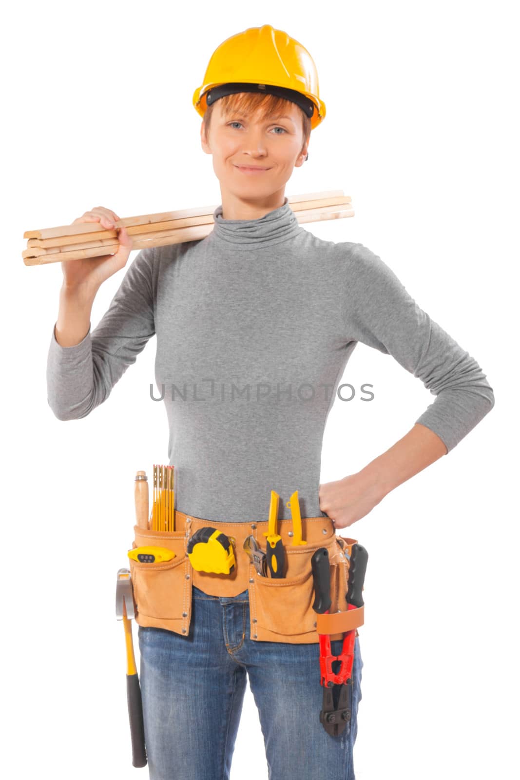 female worker wearing working clothes holding wooden planks by mihalec