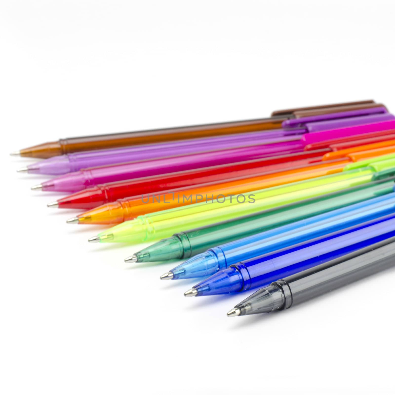 colorful pens isolated on white by ammza12