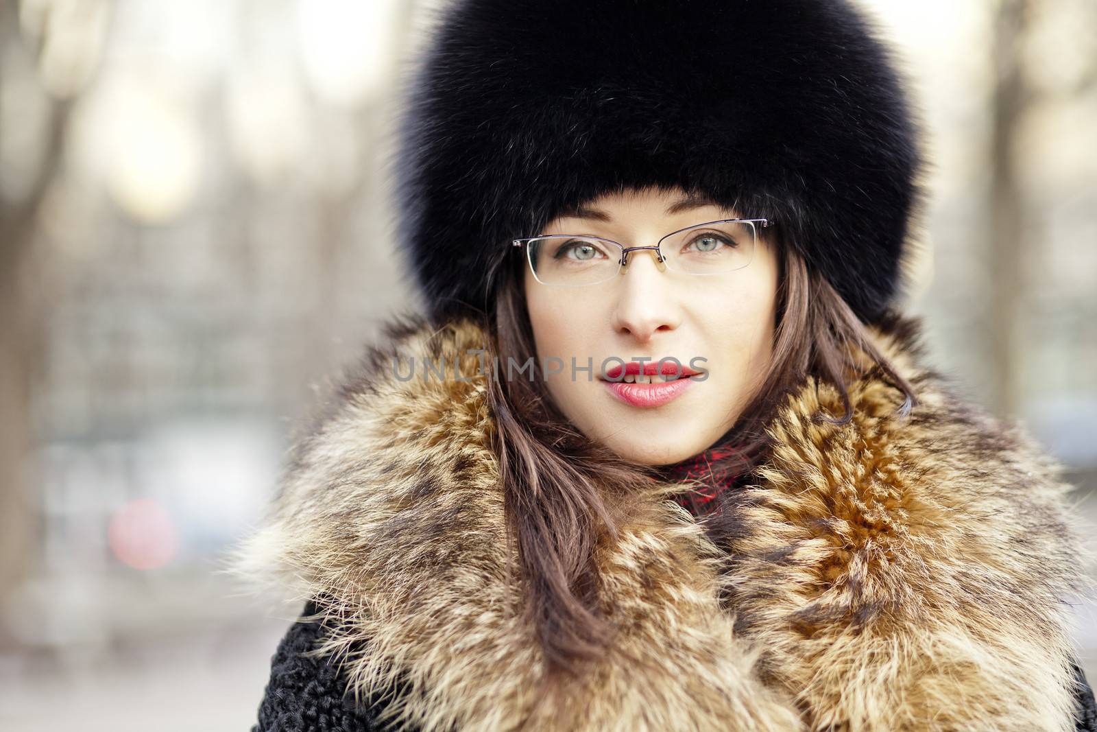Woman wearing fur hat and glasses by Kor