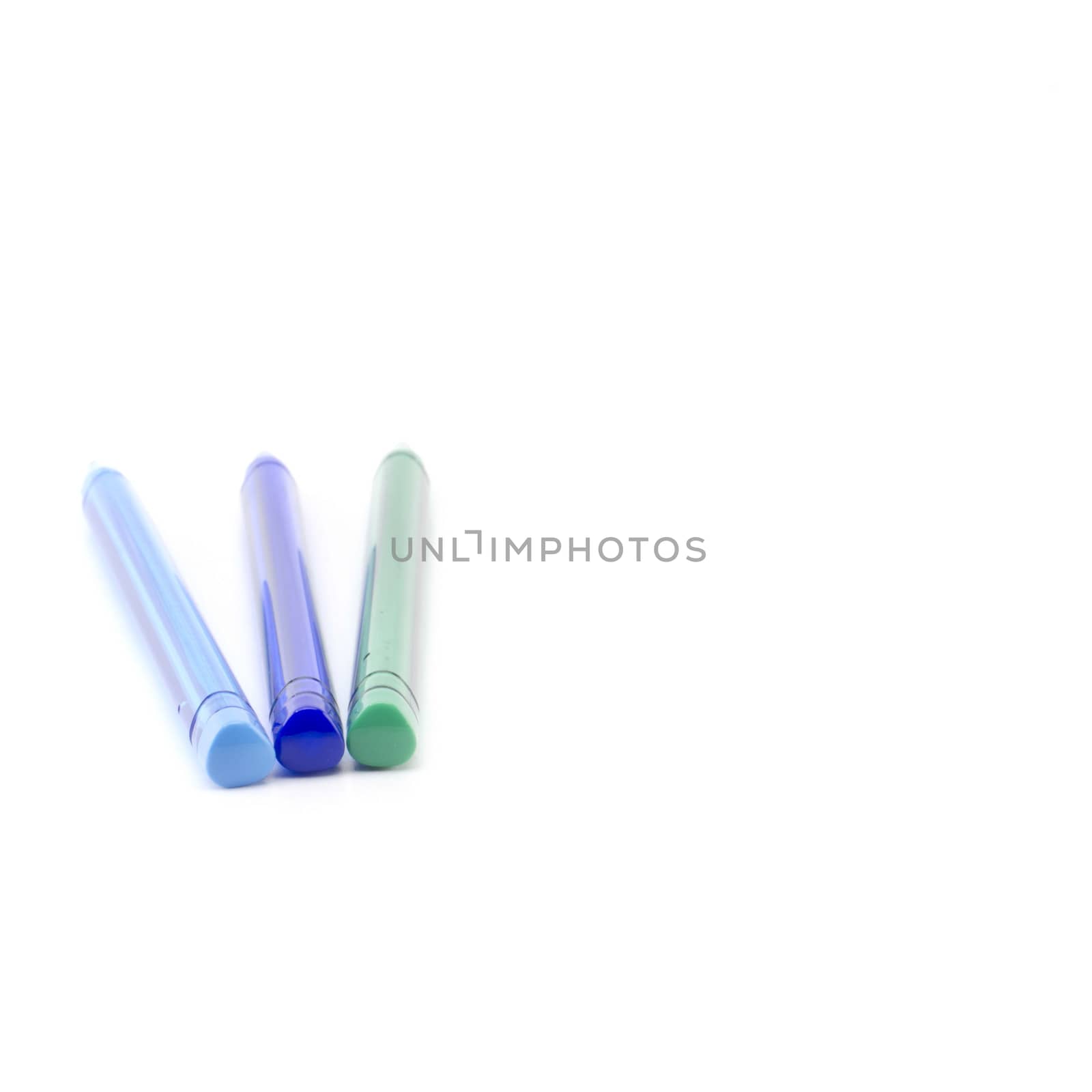 colorful pens isolated on white by ammza12