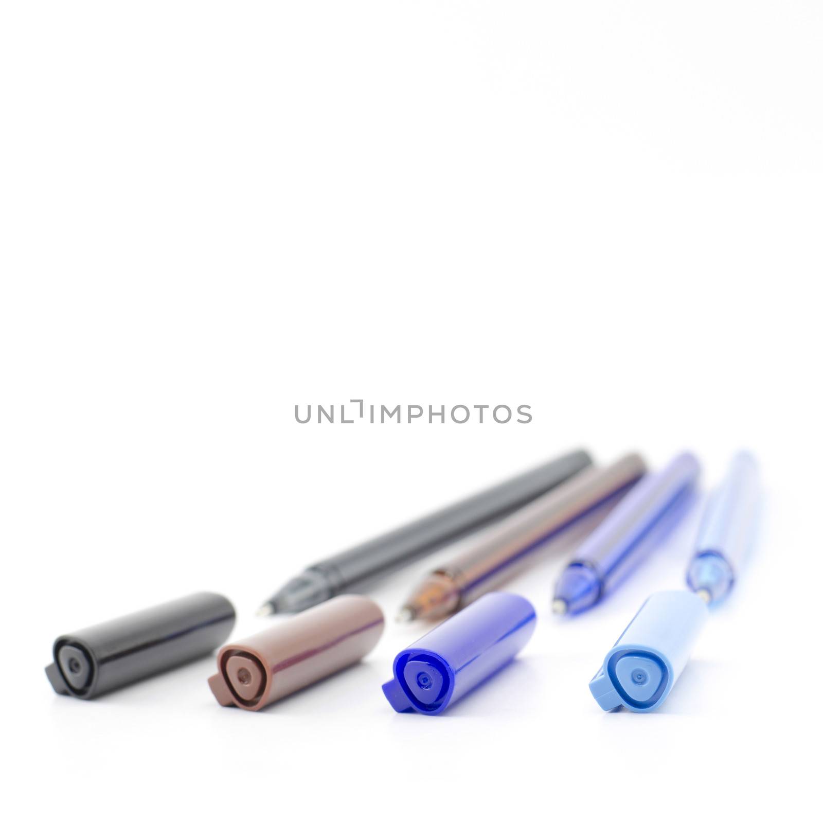 colorful pens isolated on white by ammza12