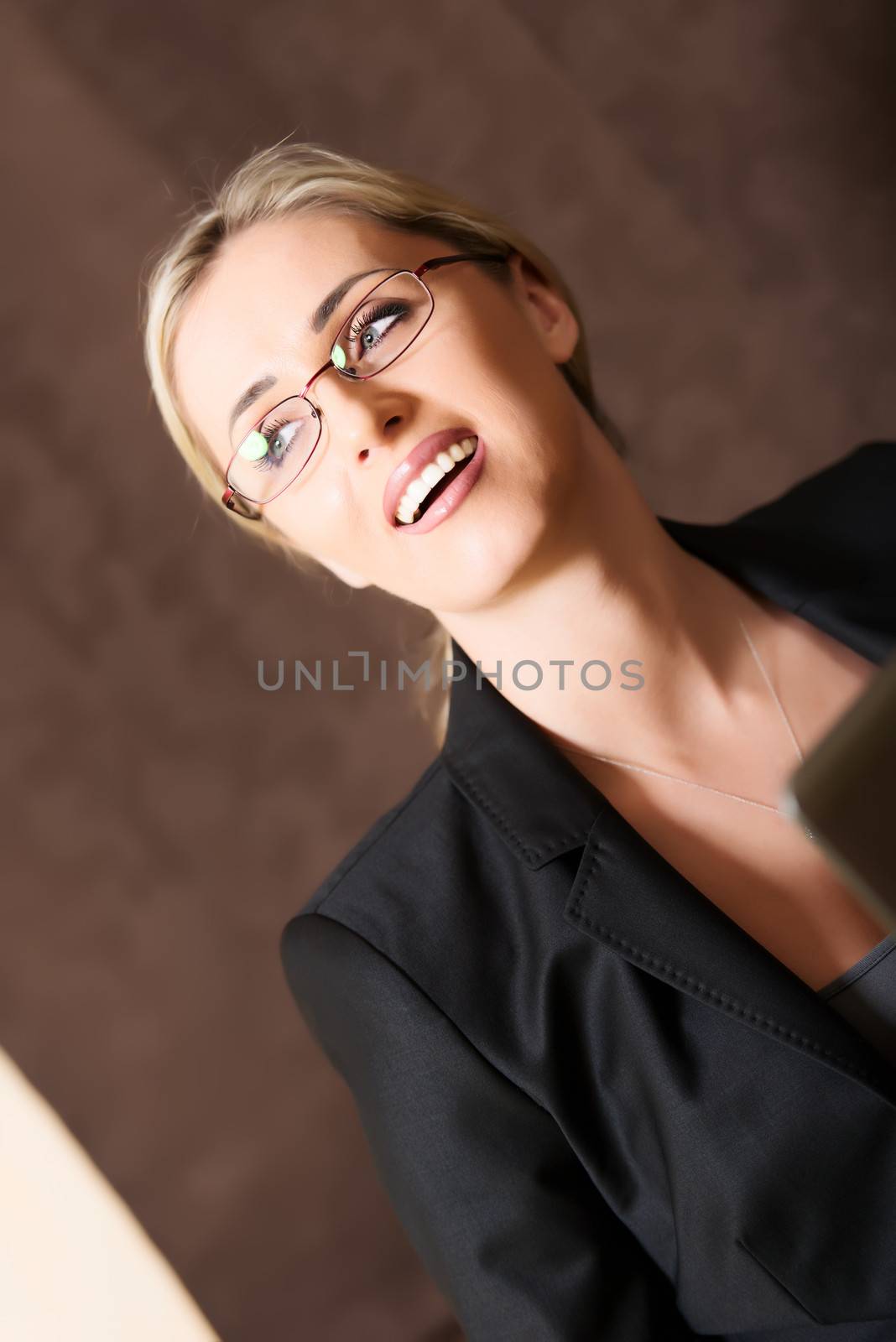 Portrait of business woman in glasses angled by Nanisimova