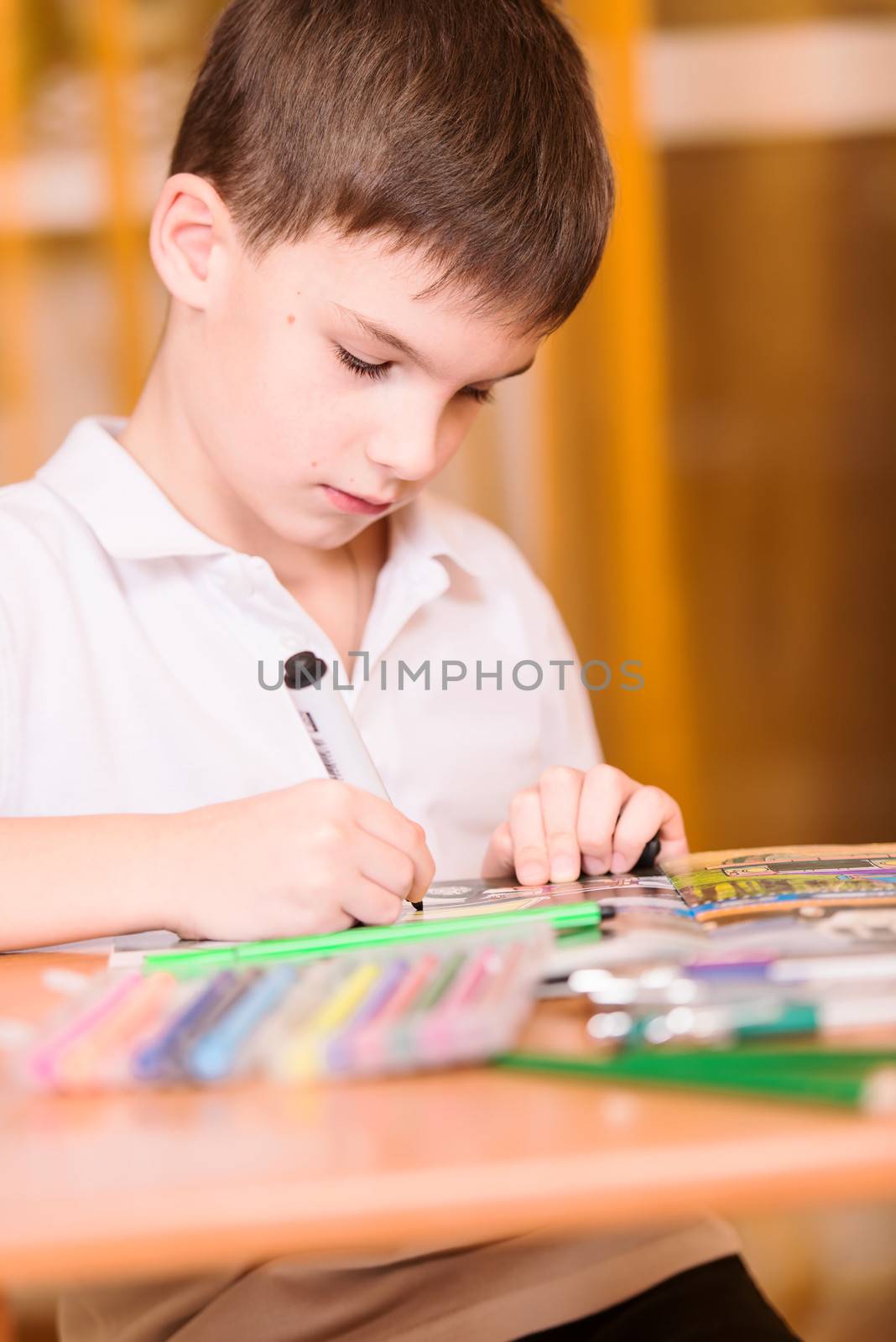 Concentrated boy colouring book portrait by Nanisimova