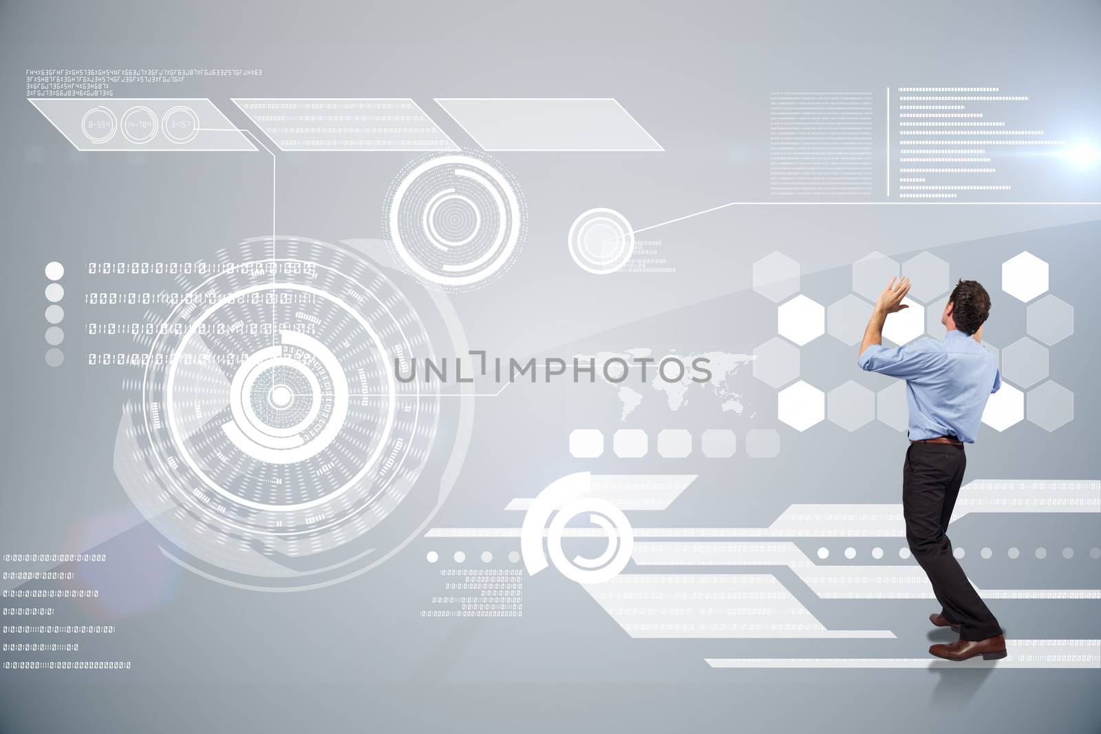 Businessman posing with arms up against futuristic technology interface